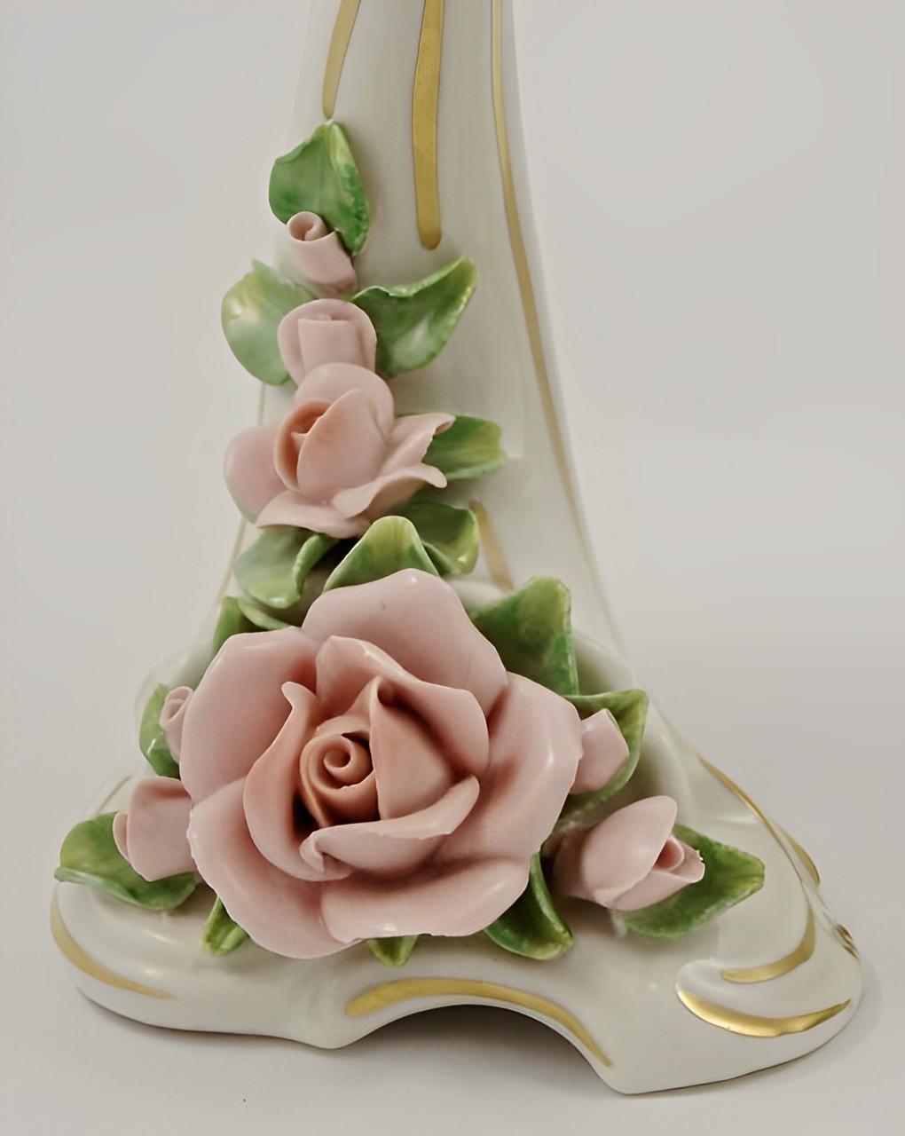 Alka Kunst Dresden beautiful pair of porcelain candlesticks with hand painted pink roses and leaves, and gold edging.

The candlesticks are height 18.7 cm / 7.36 inches, and width of the base is 9 cm / 3.5 inches. They are in very good condition.