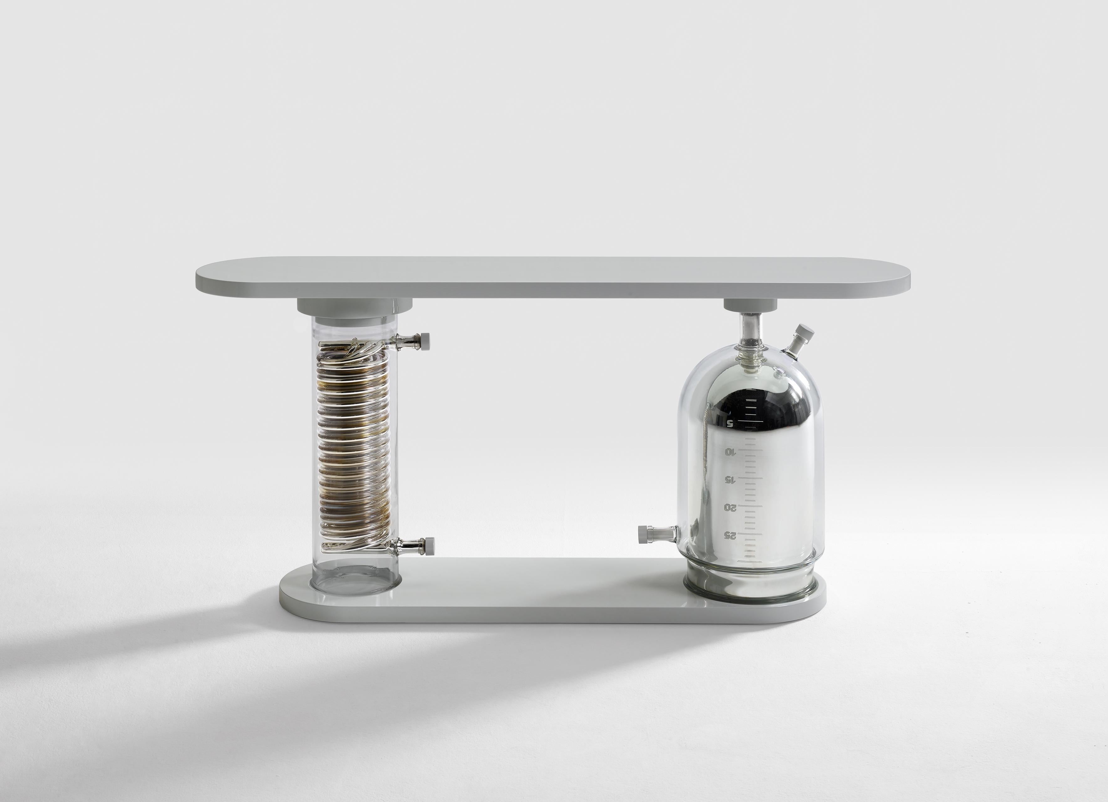 Alkemy Console Table by Vetralia
Designed by Leo De Carlo
Dimensions:  W 180 x D 38 x H 85 cm
Materials: Mirrored glass, lacquered wood.

VETRALIA
Functional Art based in Venice
Active in the collectible design proposal, Vetralia is a meeting place