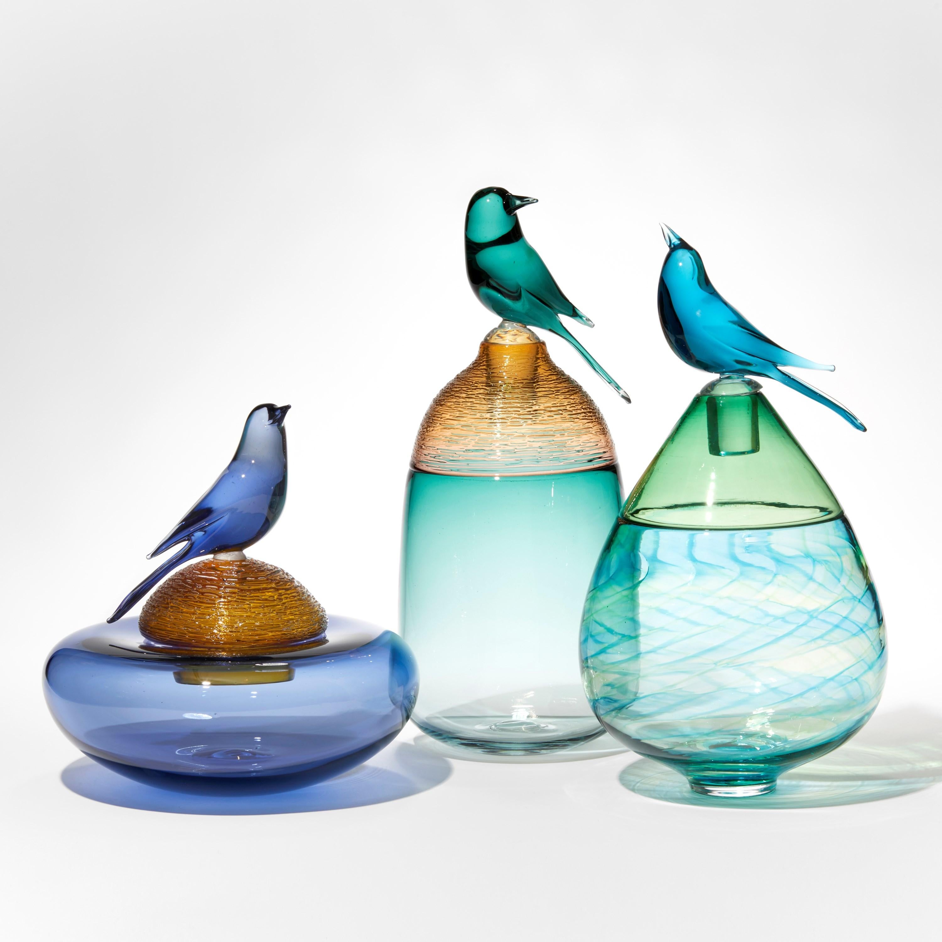 Hand-Crafted All About Birds XVII, a rich blue & amber glass bird sculpture by Julie Johnson
