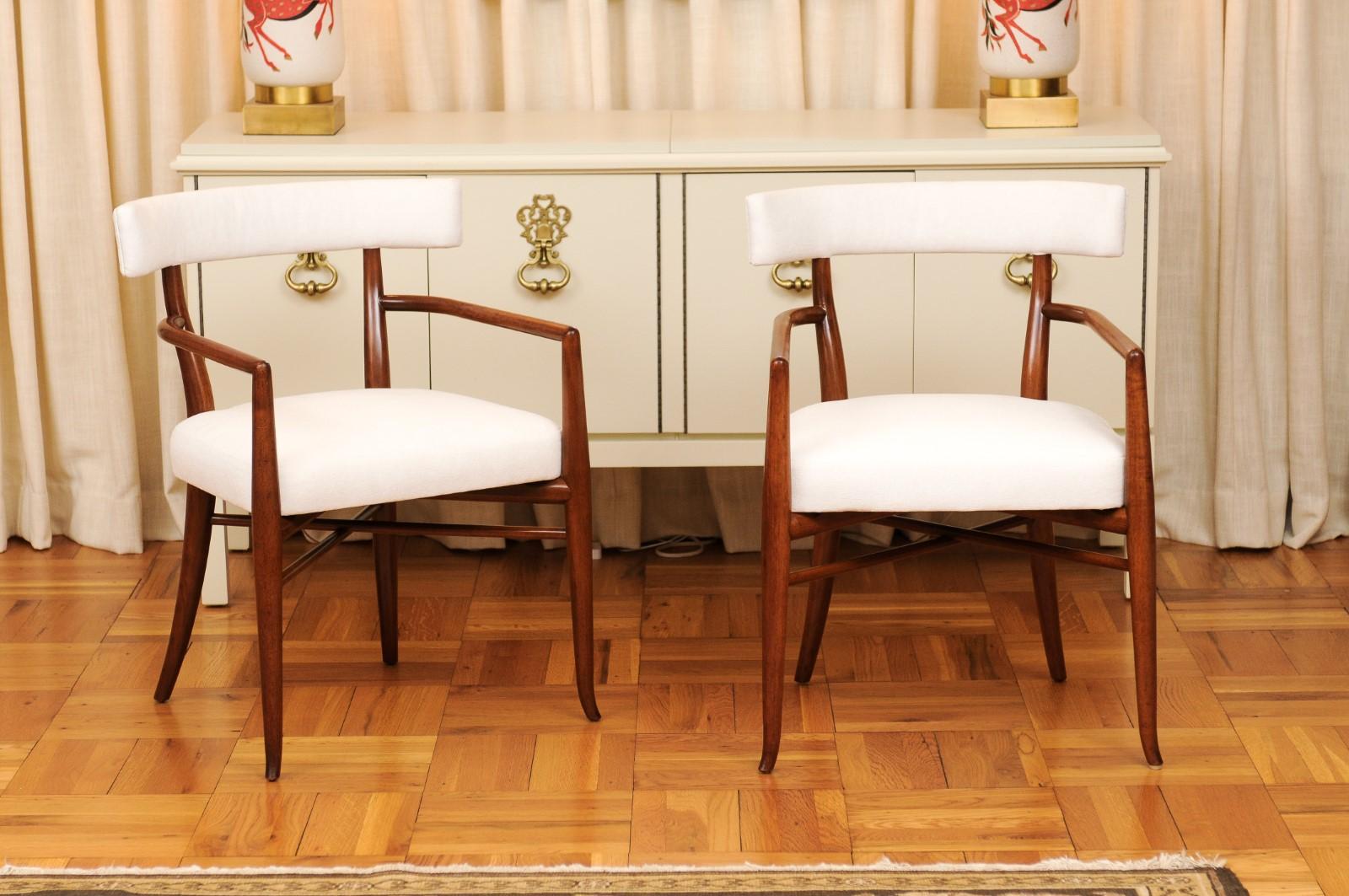 This magnificent set of dining chairs is shipped as professionally photographed and described in the listing narrative: Meticulously professionally restored, newly upholstered and completely installation ready. This large All Arm set of these rare