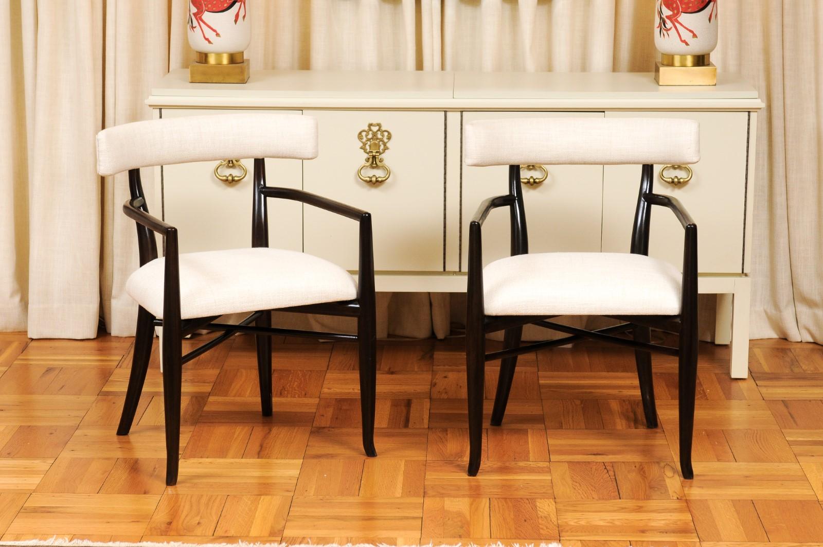 This magnificent set of dining chairs is shipped as professionally photographed and described in the listing narrative: Meticulously professionally restored, newly upholstered and completely installation ready. This large All Arm set of these rare