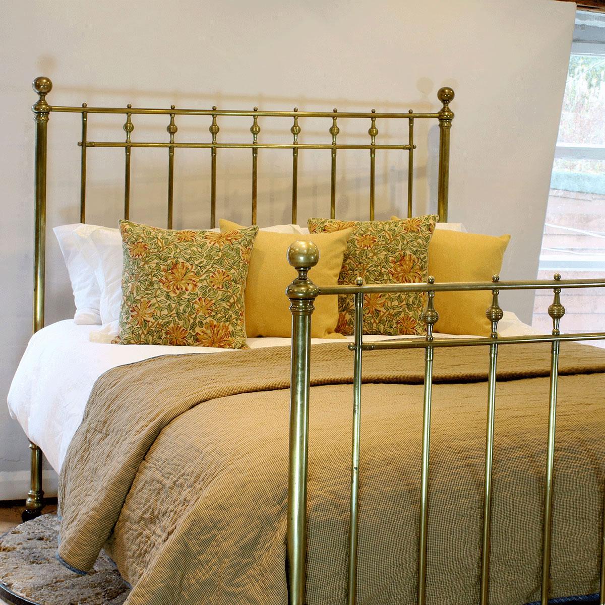 A superb all brass bed from the Victorian era with spindle decoration and fine original patina. From the late 19th century.

This bed accepts a UK King size or US Queen size (5ft, 60in or 150cm wide) base and mattress set.

The price includes a