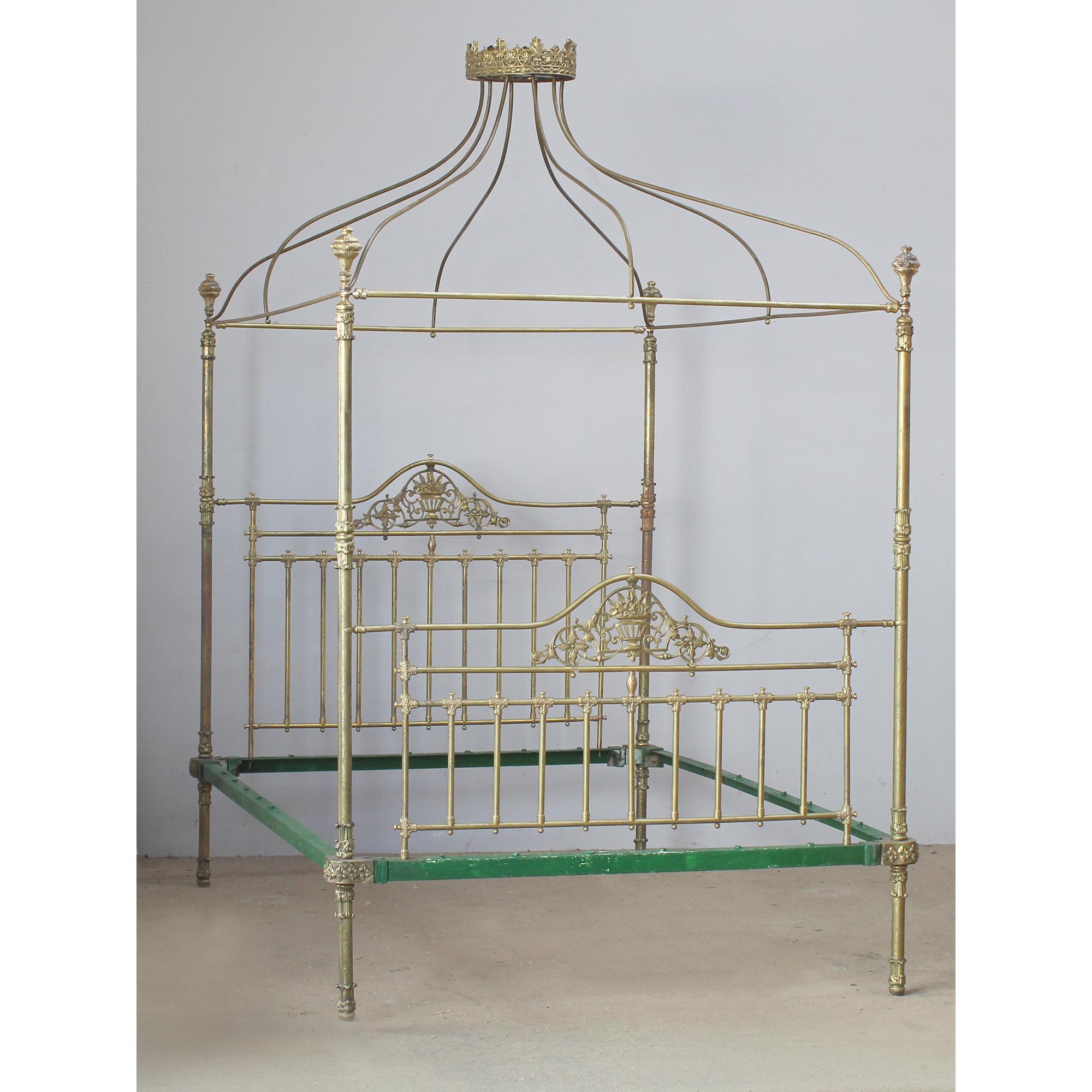 A magnificent all brass four poster bed with crown and canopy, Circa 1870.
This superb example of a late Victorian brass bed has fine etched posts with delicate castings, ornately cast brass kneecaps, brass feet and decorative brass knobs.
The two