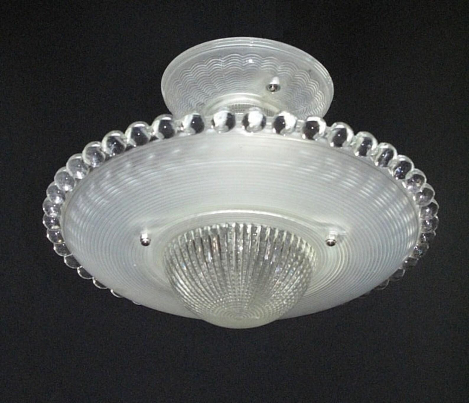 Vintage 1930s crystal glass bedroom, hallway, or bathroom ceiling light fixture. With both the ceiling canopy as well as the shade all glass, you get a beautiful sparkling array of light across the room. Detailing in the glass reminds one of a