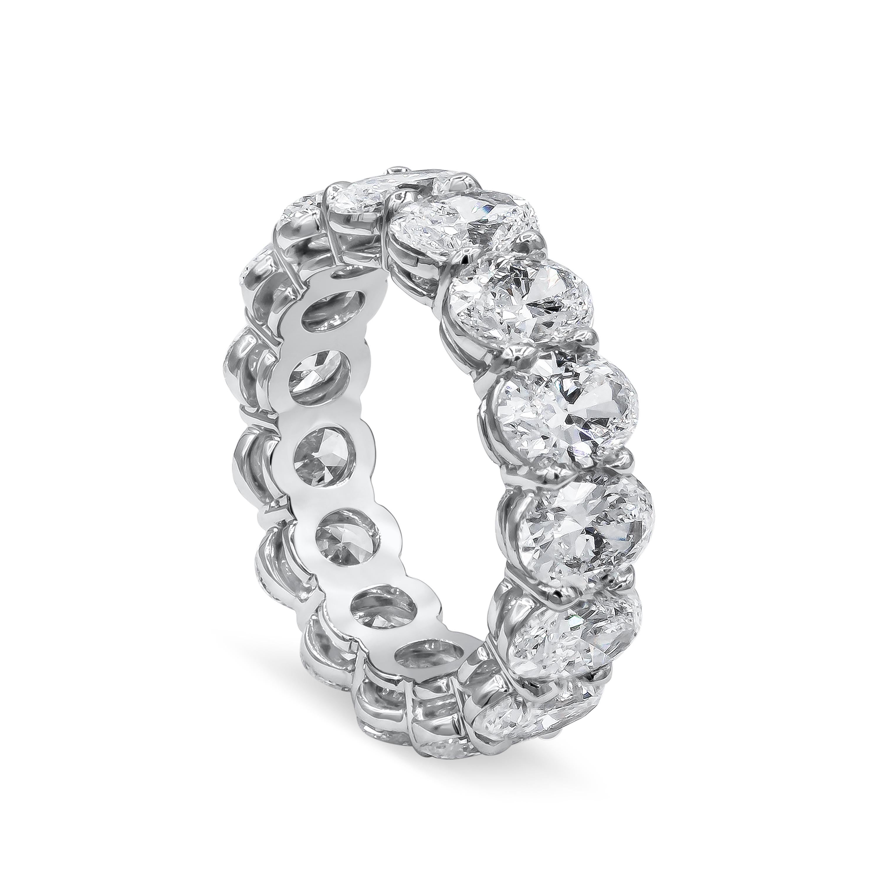 A brilliant eternity wedding band showcasing oval cut diamonds set in a shared prong, platinum mounting. Diamonds weigh 7.50 carats total. Each diamond is GIA certified as E-F color, SI clarity. Size 6 US.

Style available in different price ranges.