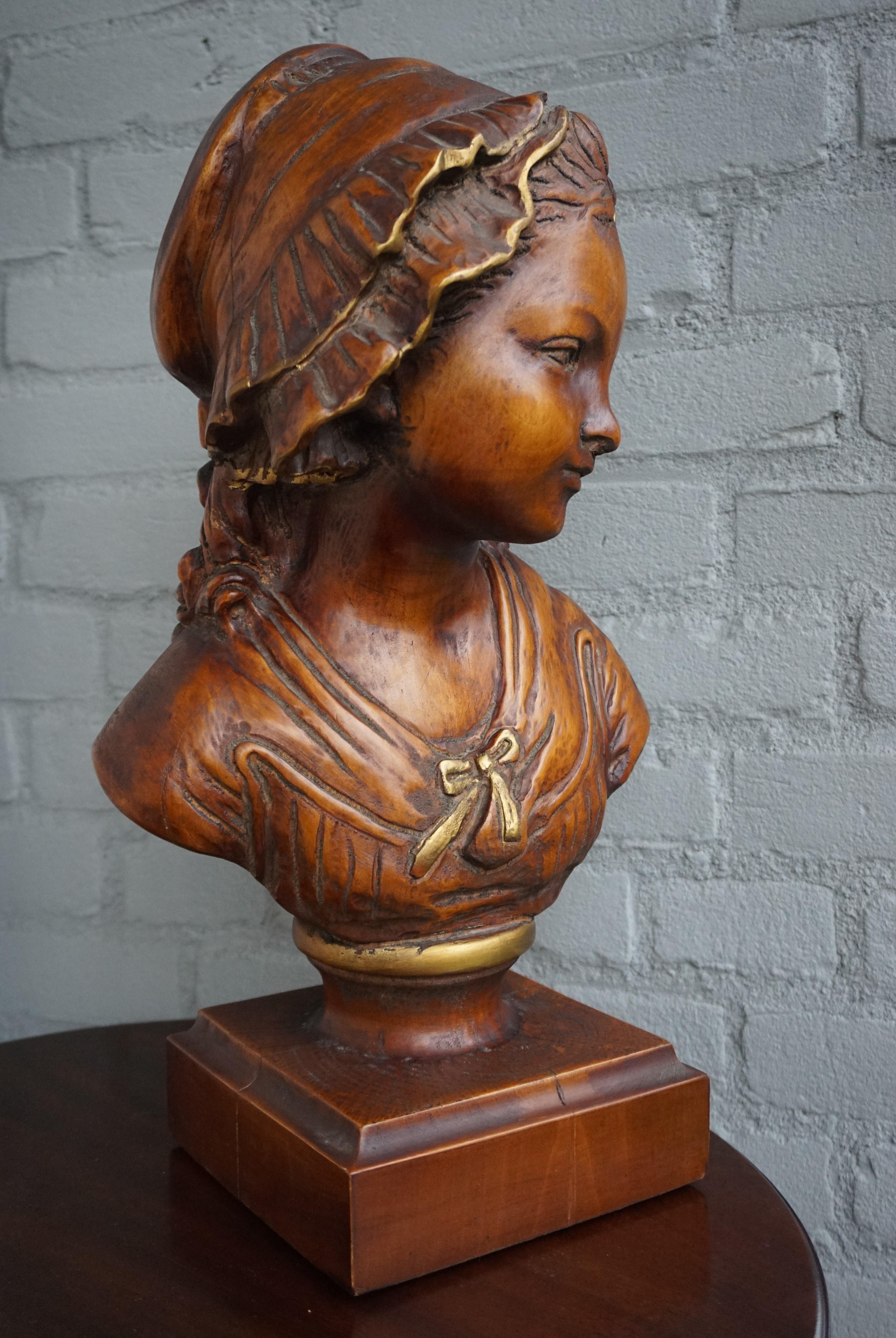 Beautifully hand carved antique wooden sculpture.

The sculptor who created this rare and exceptional young girl bust, in our view, perfectly captured her innocence and fragility. The artists of days gone by keep surprising us with the quality and