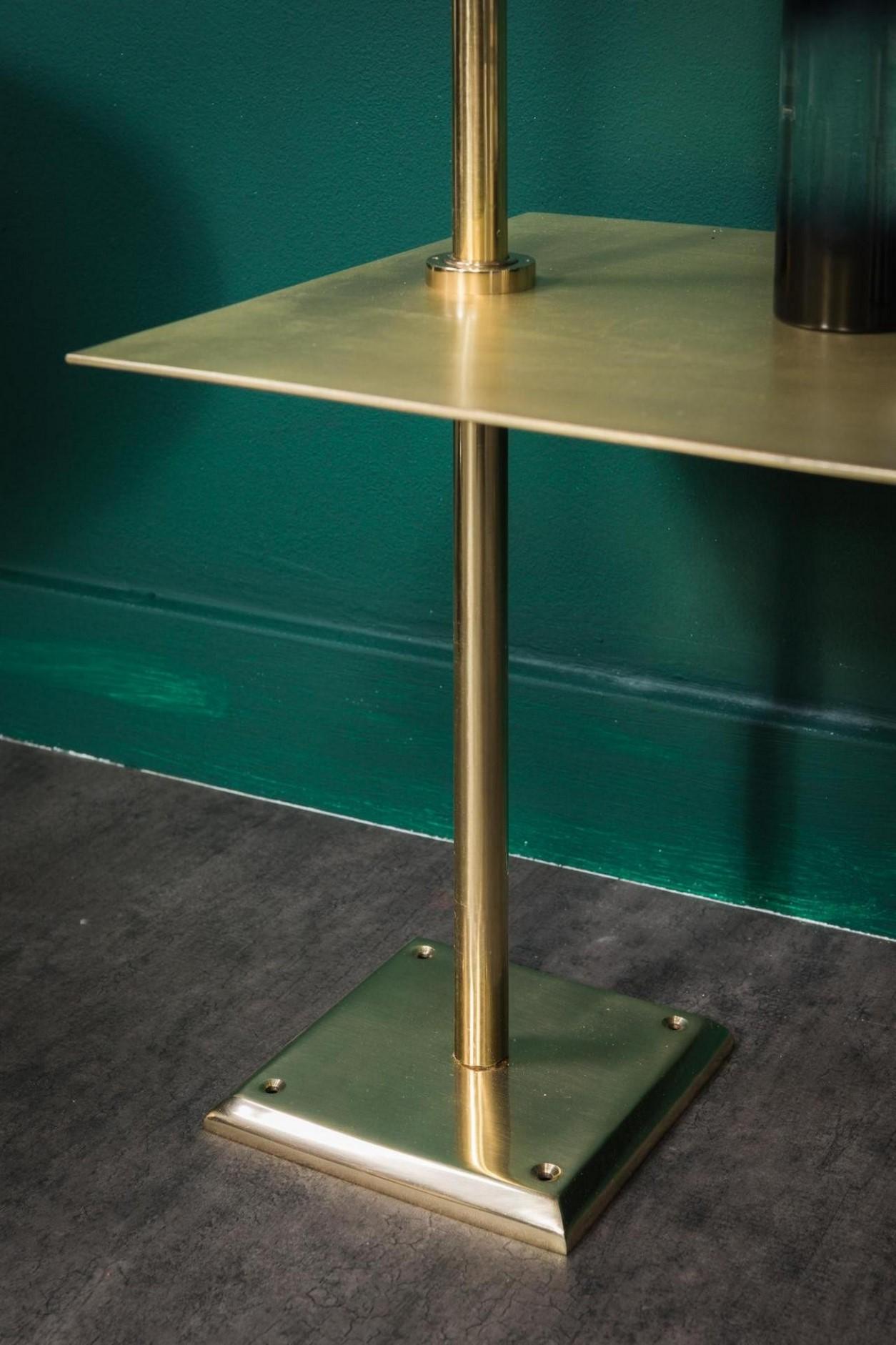 brass wall shelving unit