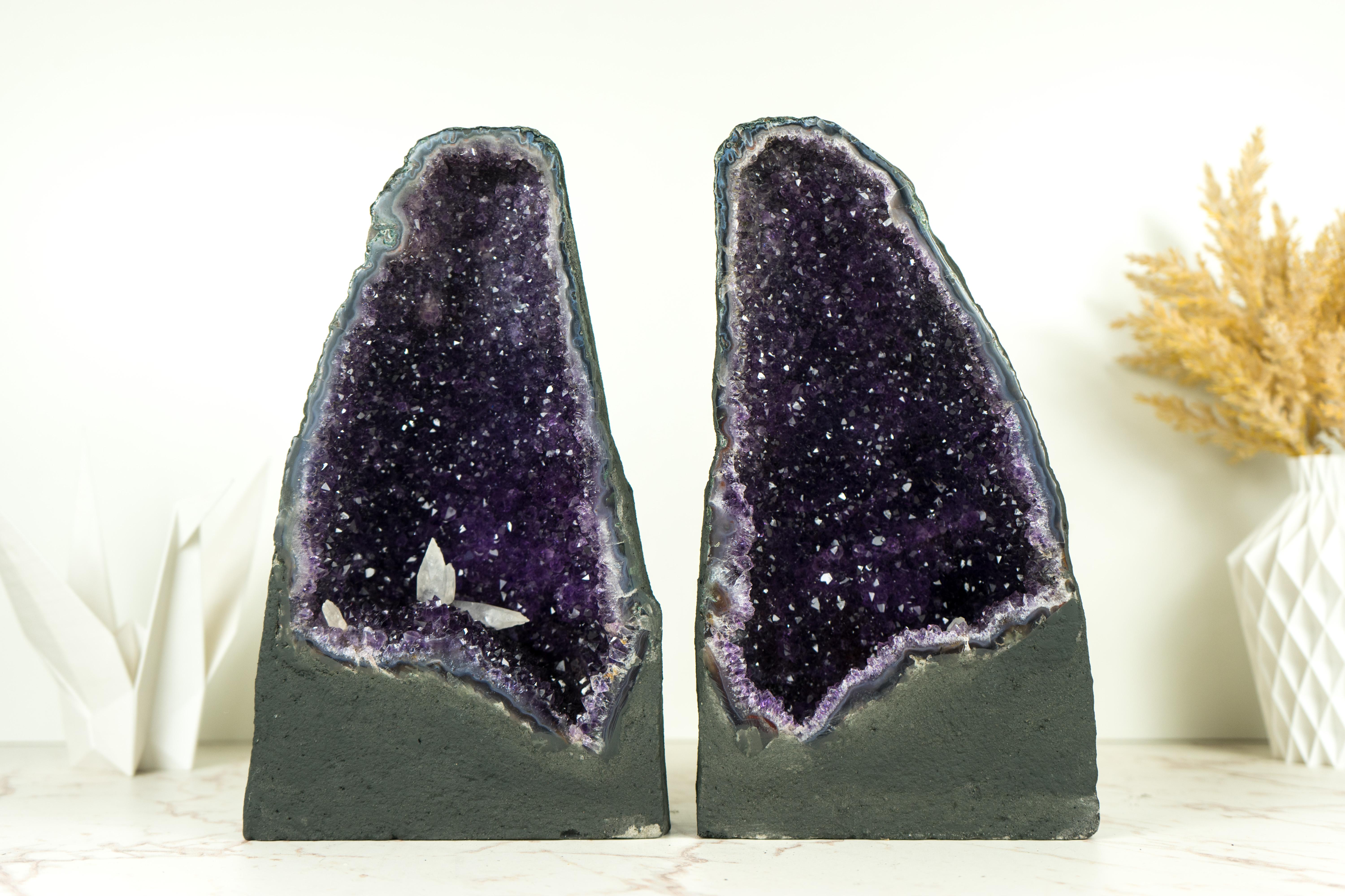 An exquisite pair of Amethyst Geode Caves, these specimens stand as a testament to nature's artistry. Formed over millions of years, this geode boasts unique and rare characteristics, including the sparkling galaxy Amethyst, a deep natural purple