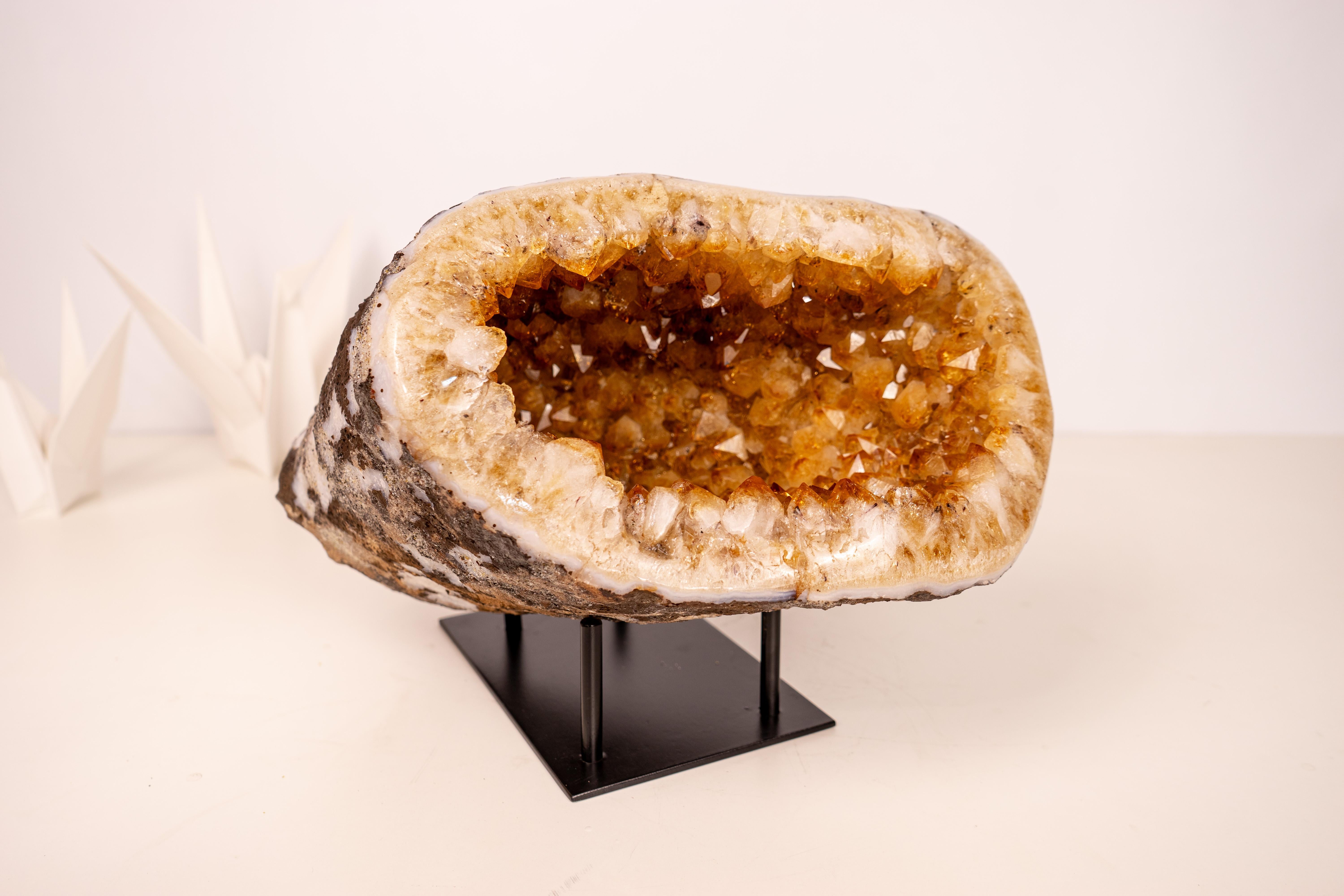 Rare All-Natural Golden Orange Citrine Cave: A Feng Shui Powerhouse

▫️ Description

A small, all-natural, yet highly energetic Citrine geode, this specimen showcases perfect, sparkly points that cover its entire interior, creating a stunning