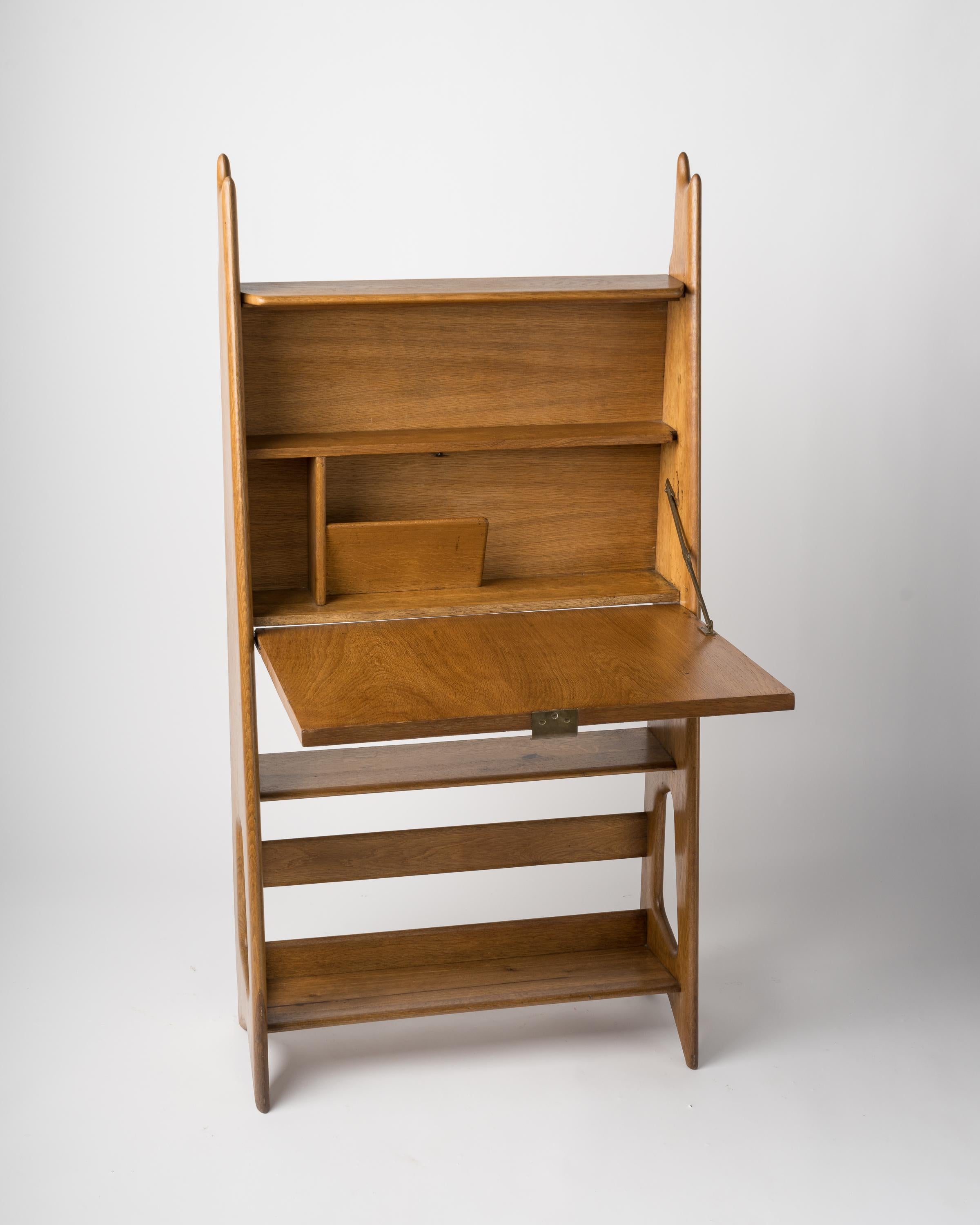 French reconstruction designer Pierre Cruège's forme libre masterpiece bureau with abattant.
Rare natural oak version
Brass details
Inside the desk compartment, a letter rack and a shelf can be found.
In good vintage condition
This 