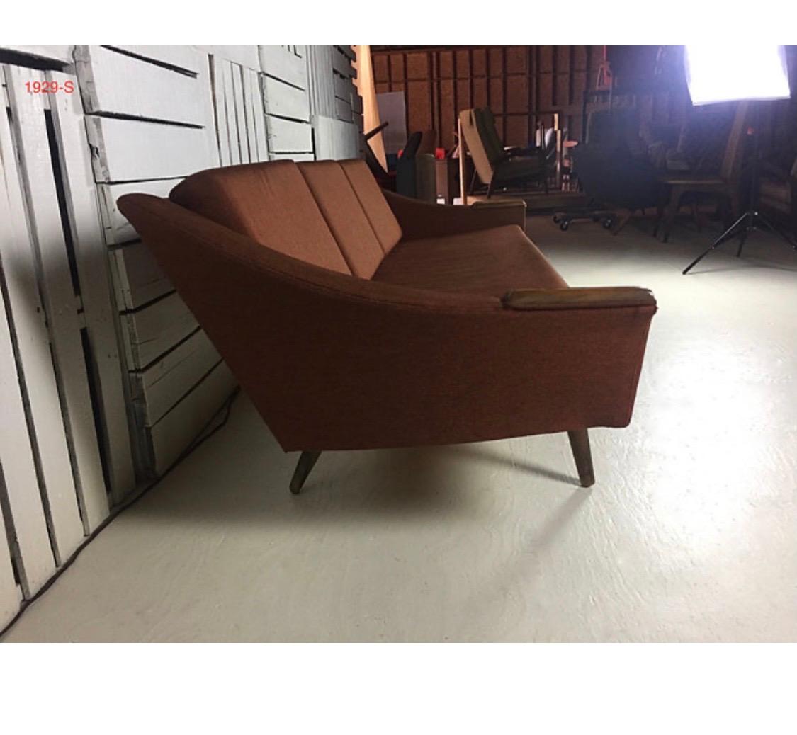 Authentic Adrian Pearsall pieces are some of his most dramatic creations. They also need space!

Magnificent and coveted signed Adrian Pearsall for Craft Associates sofa with walnut hand rests and curved back. The fabric is original and probably