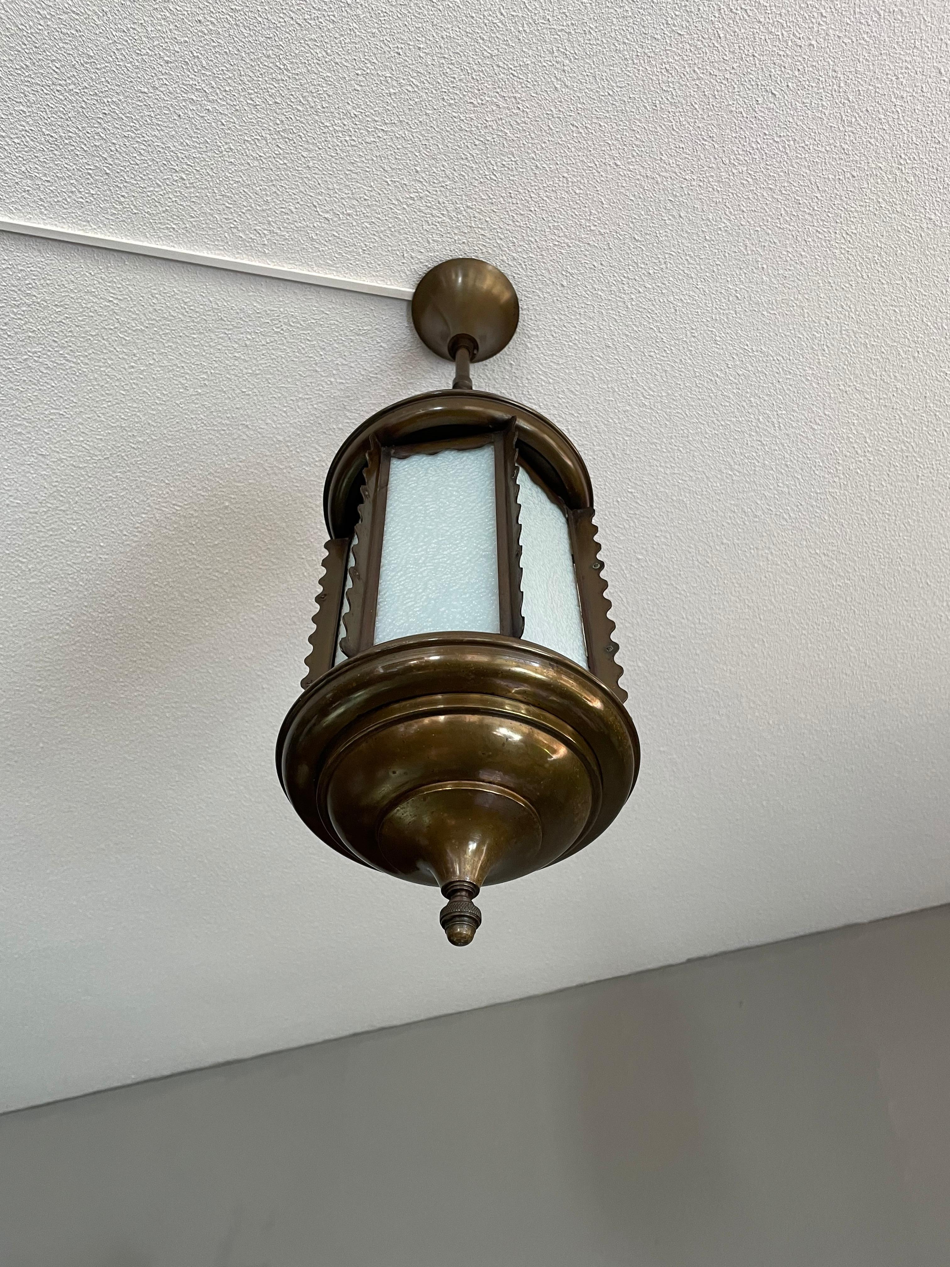 Stunning and good size Arts and Crafts ceiling lamp.

If you are looking for the ideal pendant to light up your entrance or bedroom then this antique work of beauty could be perfect. This European Arts and Crafts pendant is beautiful in shape, made