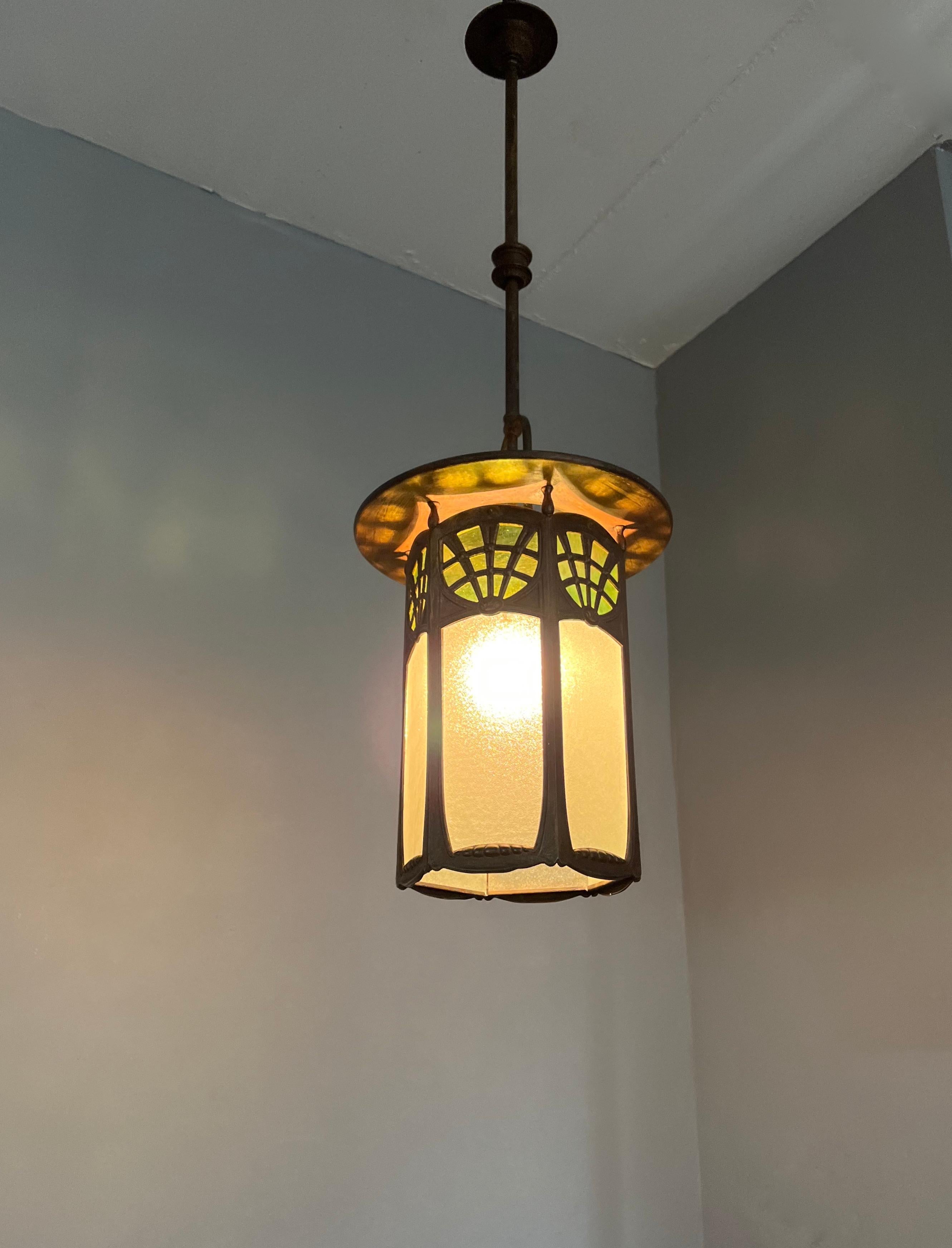 Stunning all handcrafted brass Arts & Crafts pendant with rare two-color glass panels.

If you are looking for the ideal pendant to light up your Arts and Crafts (inspired) entrance, bedroom or landing then this handcrafted beauty could be