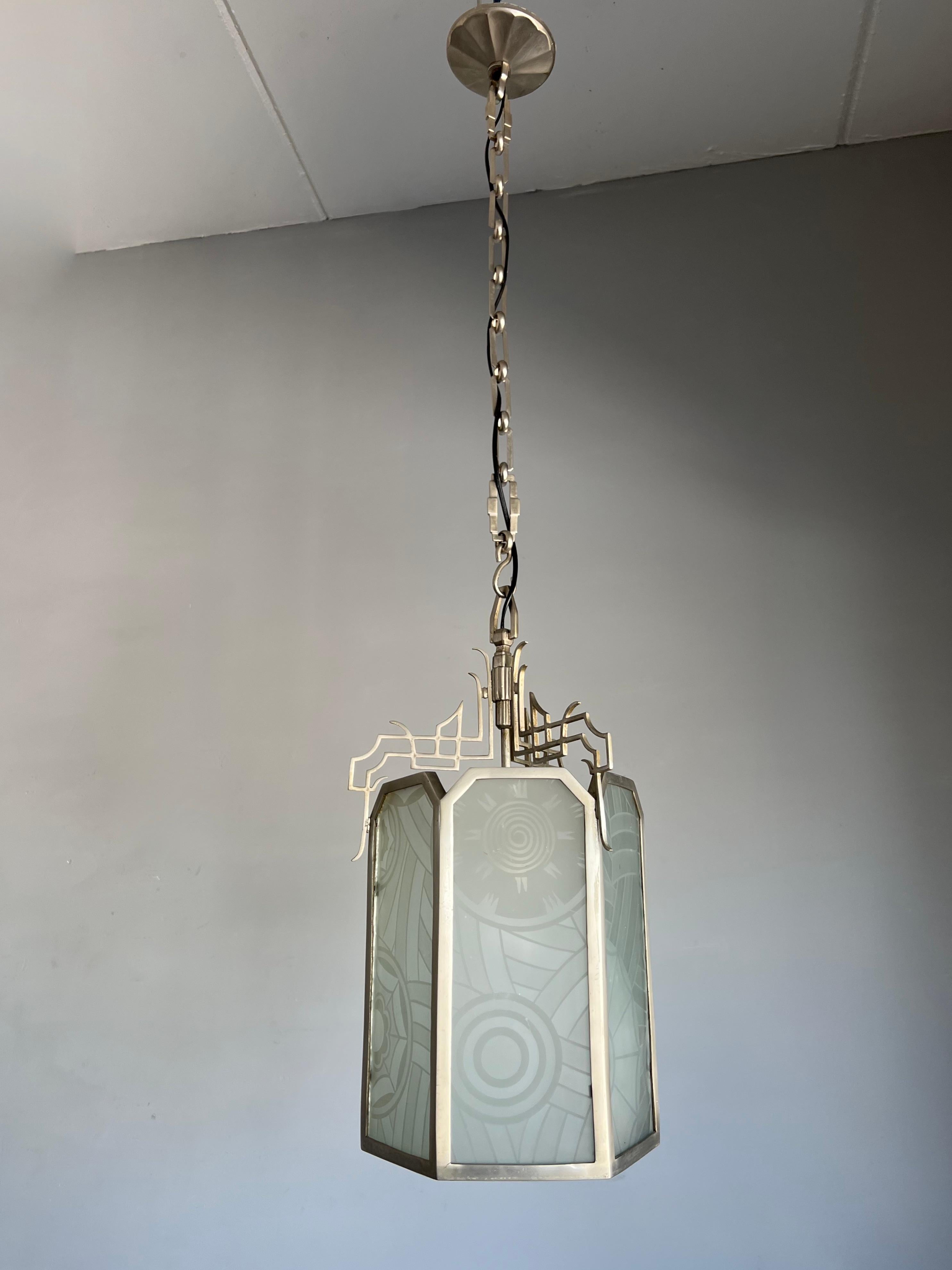 Stunning all handcrafted brass Art Deco pendant with rare engraved, art glass panels.

If you are looking for the ideal pendant to light up your Art Deco (inspired) entrance, bedroom or landing then this handcrafted beauty could be perfect. This