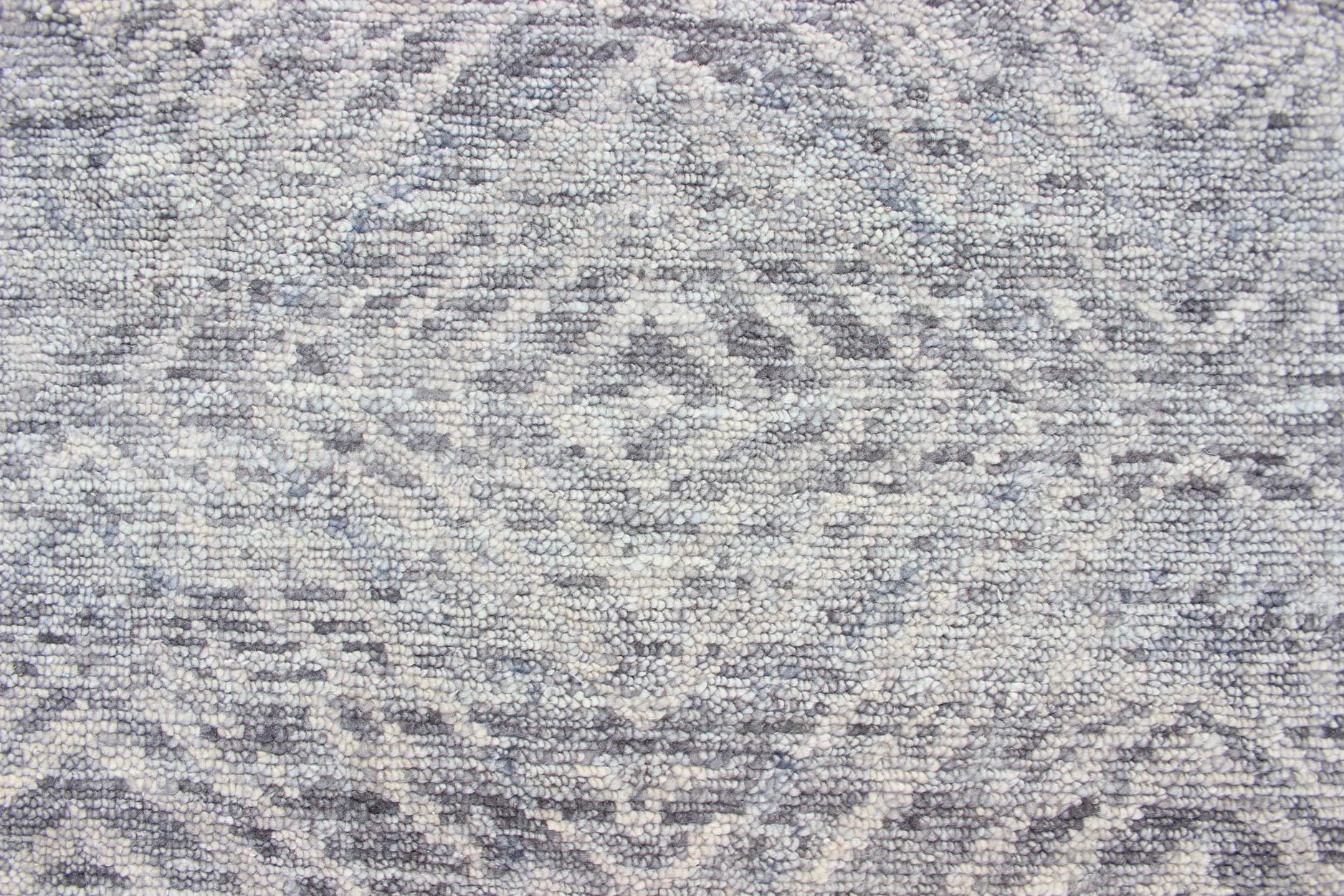 All-Over abstract Diamond Modern rug in Light gray, Green made with 100%wool pile  

Measures 9' x 12'
This abstract modern casual was hand-knotted in India during the 2010's. The background features a blend of gray, green, taupe, and cream to