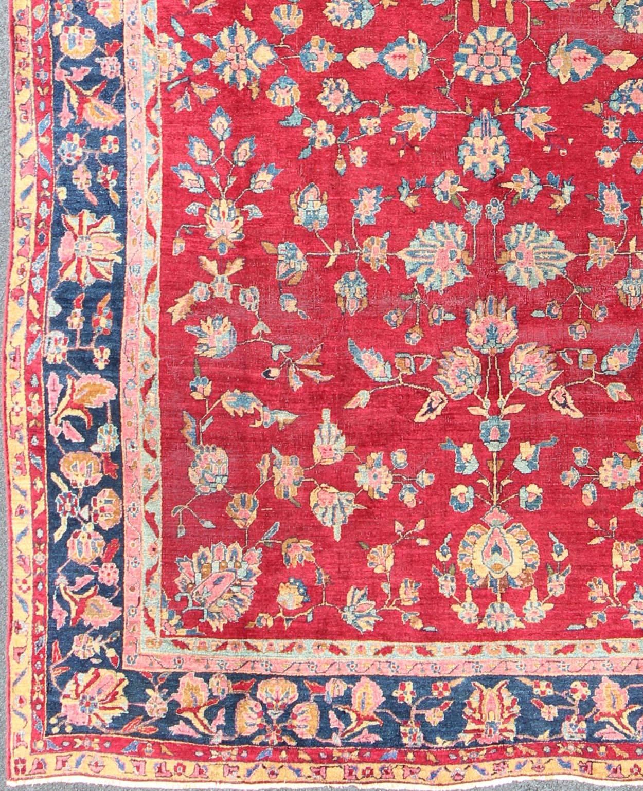 All-over floral design antique Indian Amritsar rug in red and blue tones, Keivan Woven Arts / rug B-0103, country of origin / type: Indian / Sarouk, circa 1910.

Measures: 8'10 x 12'2

This immaculately woven early 20th century Amritsar rug