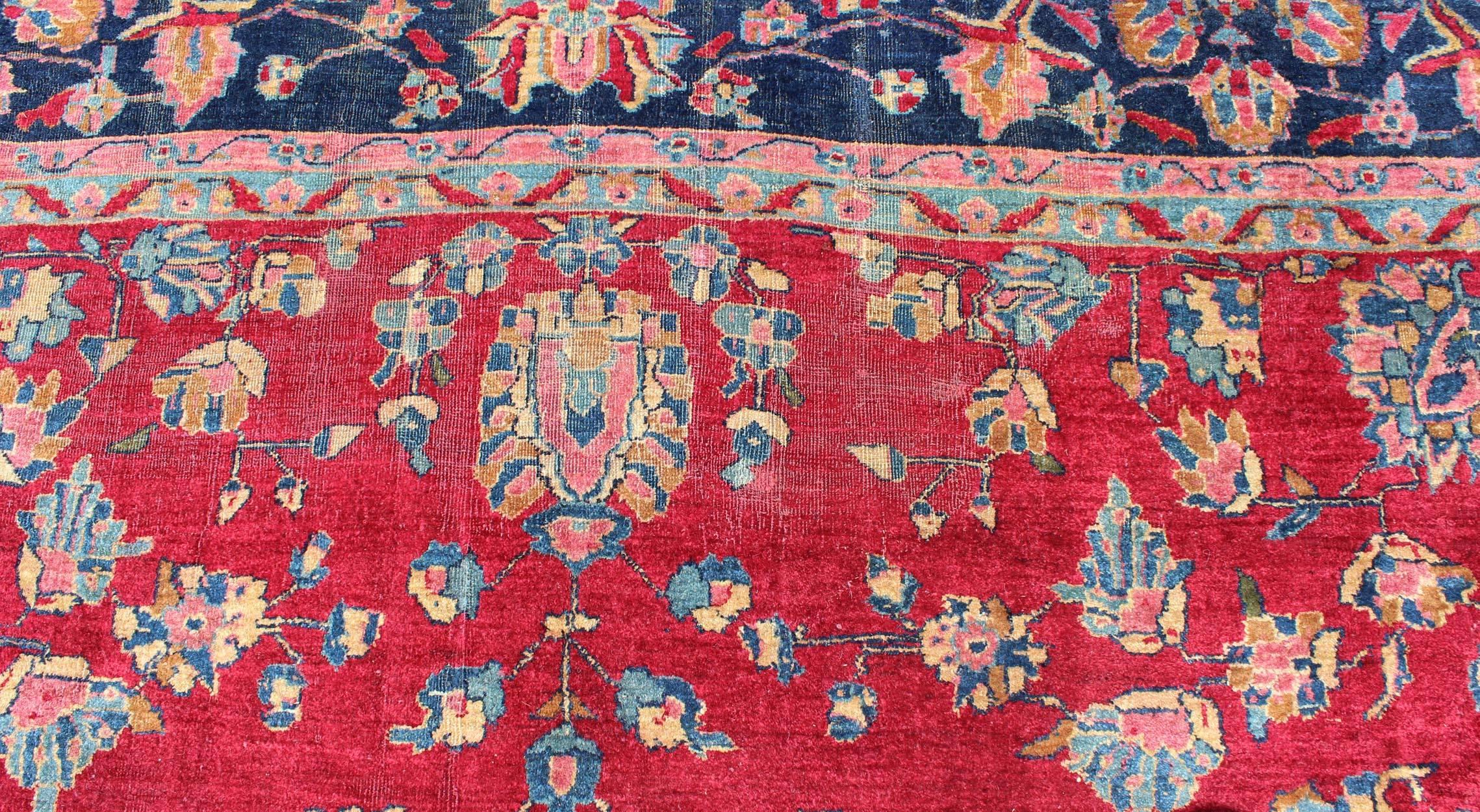 All-Over Floral Design Antique Indian Amritsar Rug in Red and Blue Tones In Good Condition For Sale In Atlanta, GA