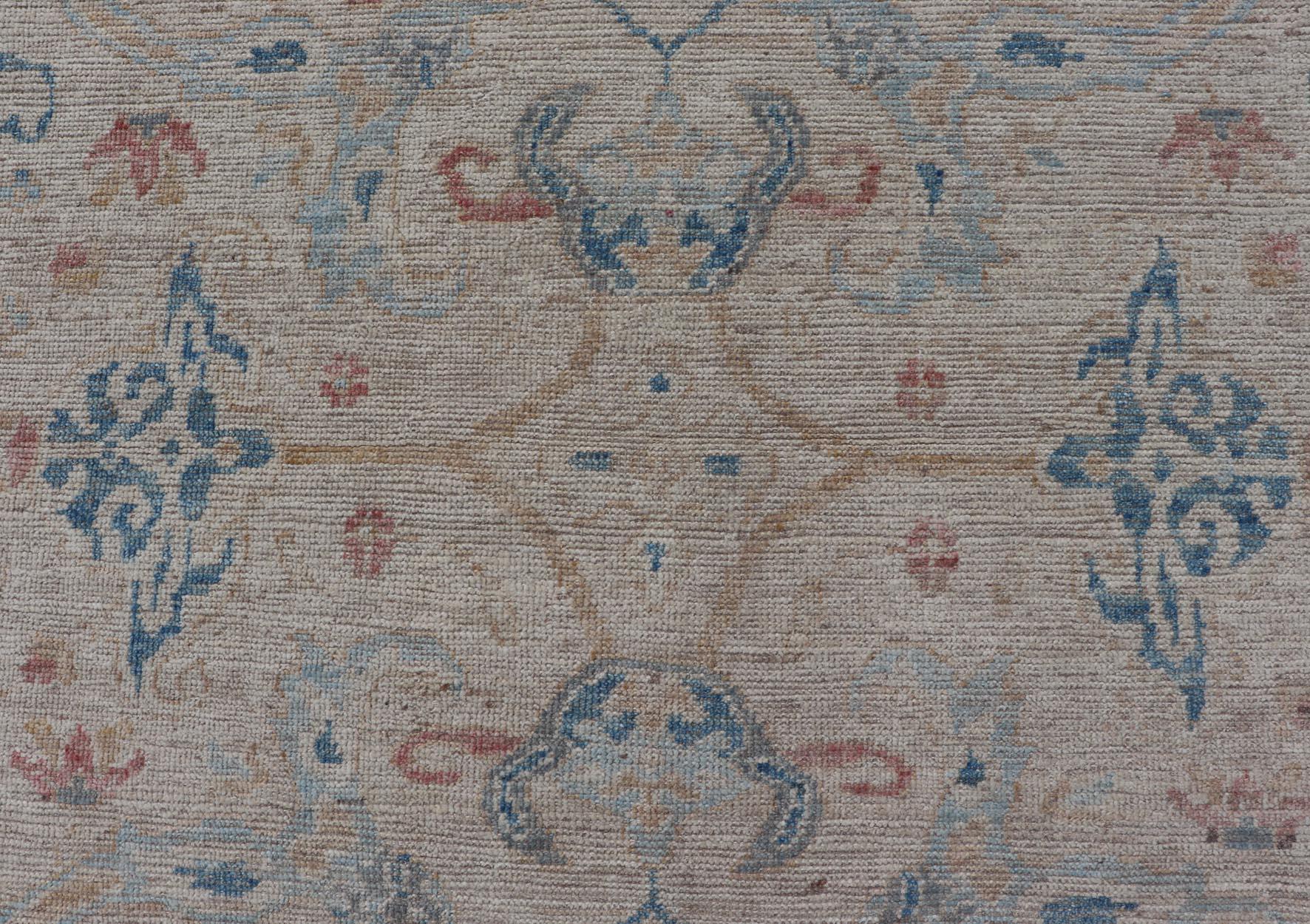 Wool All-Over Hand Knotted Oushak Rug with Arabesque Design in Ivory and Blue Tones For Sale