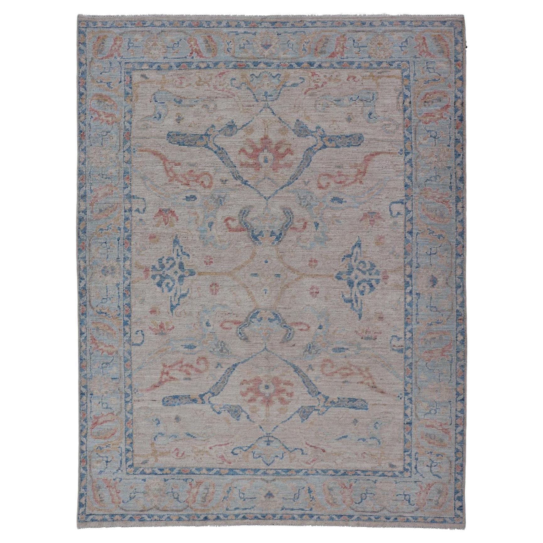 All-Over Hand Knotted Oushak Rug with Arabesque Design in Ivory and Blue Tones For Sale