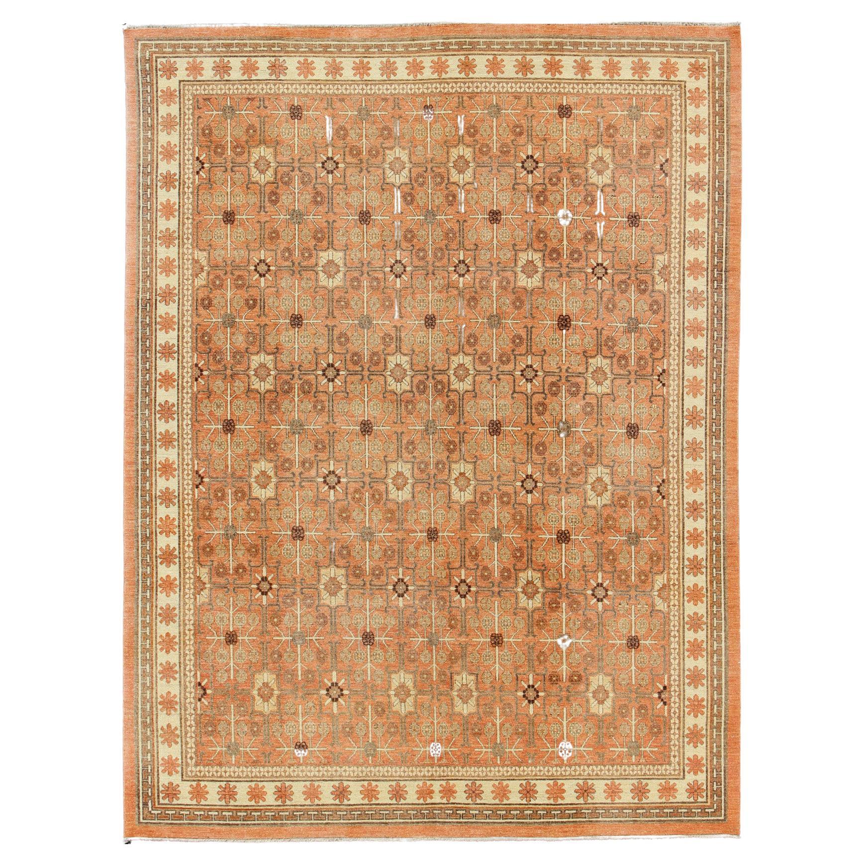 All-Over Design Khotan Rug in Light Tangerine Background. Charcoal, Brown, Green