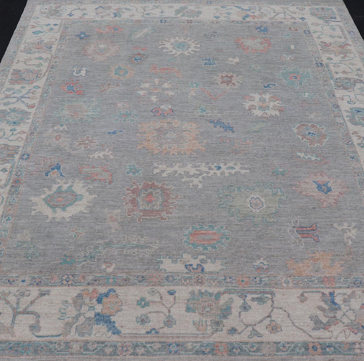 Measures: 7'10 x 9'8 
All Over Modern Floral Oushak with A Light Blue-Gray Field and Border With Color. Keivan Woven Arts; rug AWR-12018 Country of Origin: Afghanistan Type: Oushak Design: All-Over, Floral, Arabesque-Floral 21st Century

This