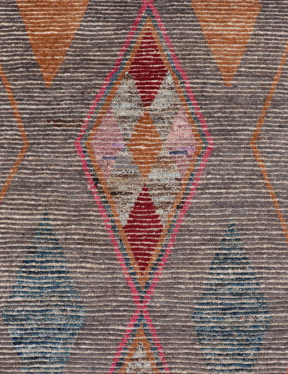 All-Over Modern Tribal Design on a Grey Background with Medallions With Red. Keivan Woven Arts/ rug SNK-2271, country of origin / type: Afghanistan / Piled, condition: new
Measures: 3'4 x 15'11 
This runner features a modern all-over modern design