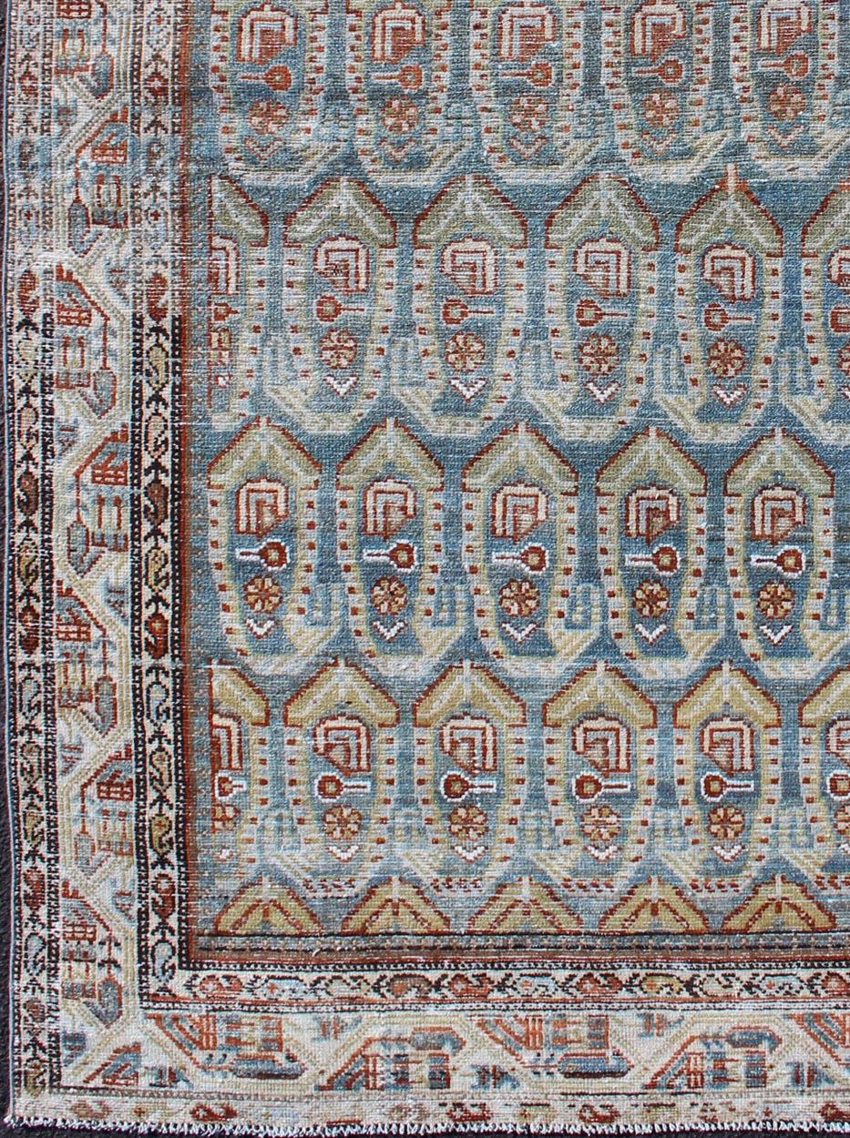 Blue and red Persian antique Malayer Rug with sub-geometric Paisley design, rug na-180382, country of origin or type: Iran / Malayer, circa 1920.

This magnificent antique Persian Malayer rug (circa 1920) bears a beautiful, expansive, all-over sub