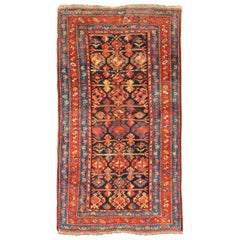 Tapis persan antique kurde bleu et rouge à motif tribal intégral
