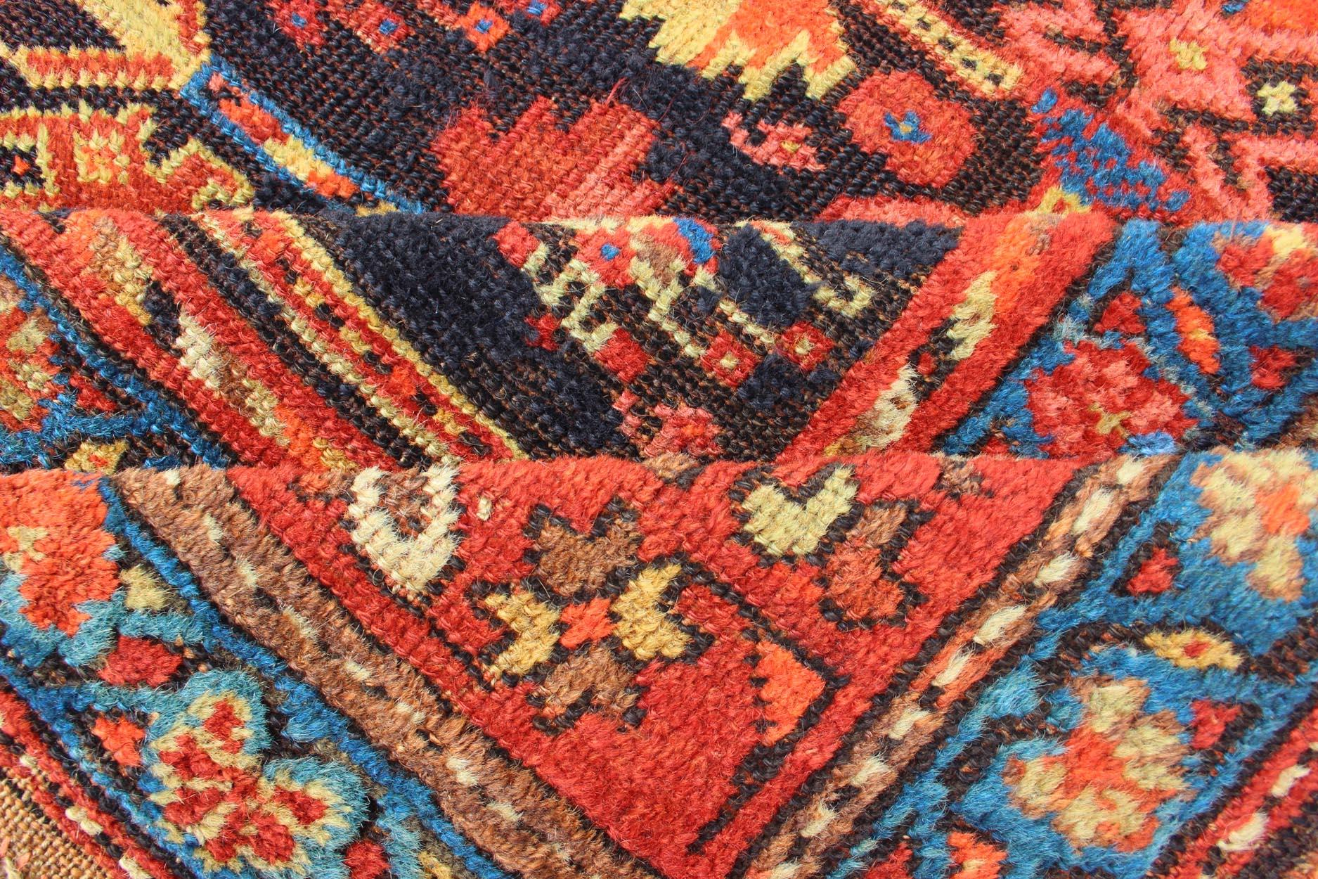 Hand-Knotted All-Over Tribal Design Antique Persian Kurdish Rug in Blue & Red For Sale