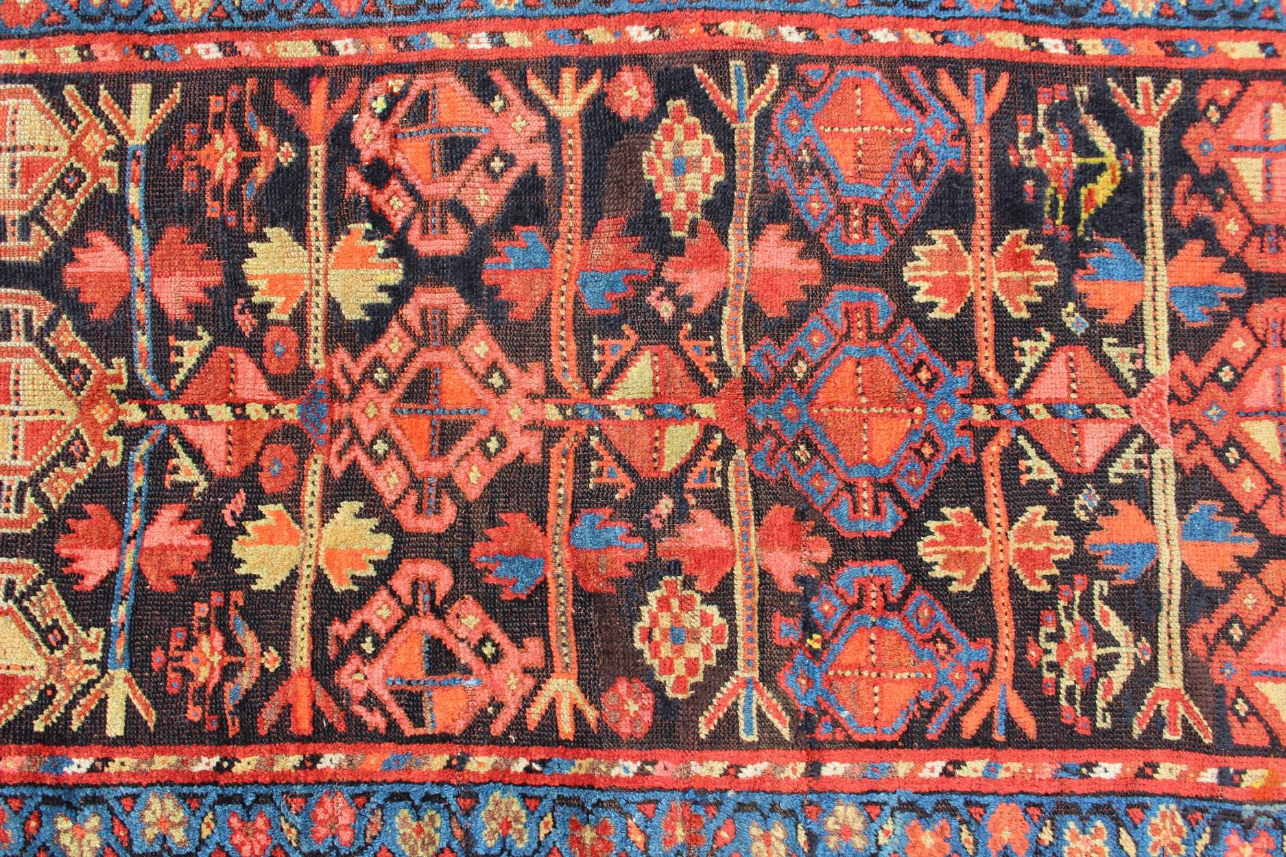 All-Over Tribal Design Antique Persian Kurdish Rug in Blue & Red In Excellent Condition For Sale In Atlanta, GA