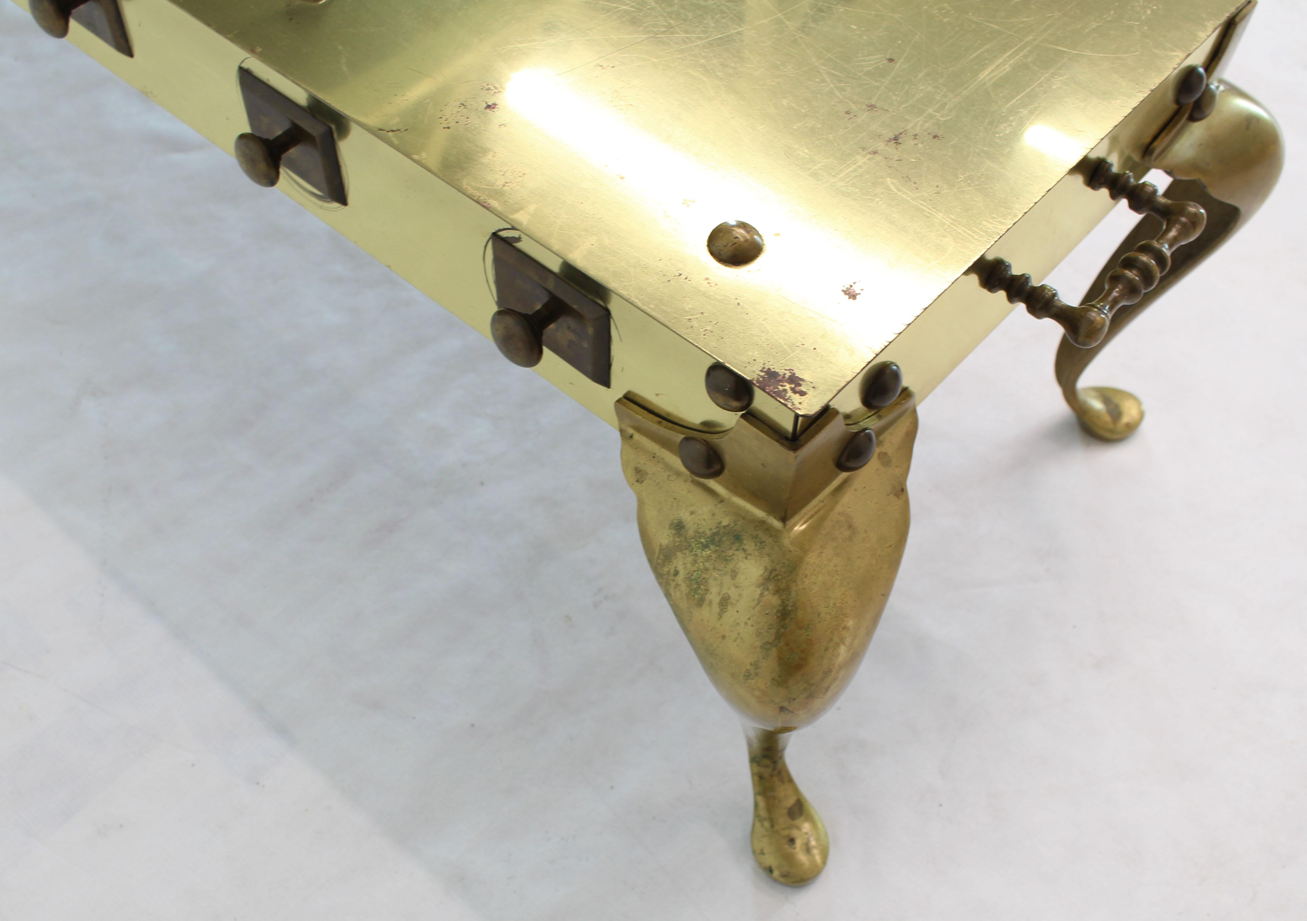Unusual all solid brass reinforced with studs long rectangle coffee table.