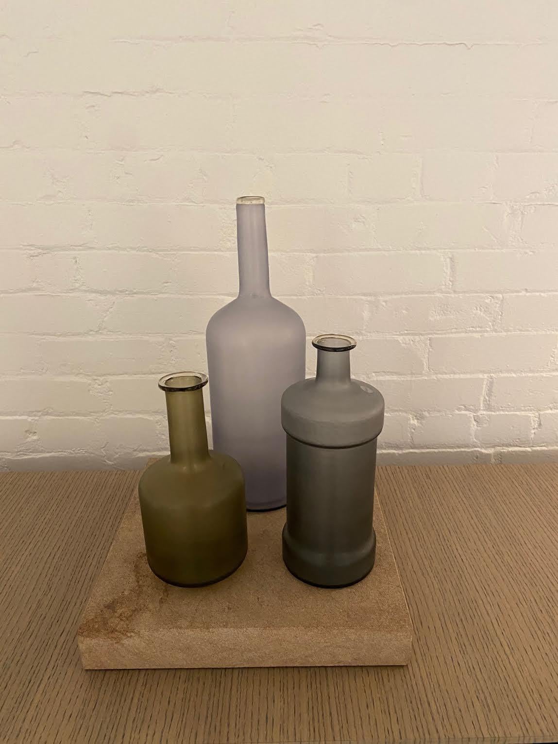 Alla Morandi, a collaboration with Venini with artist Matteo Thun, is the atemporal atmosphere of Morandi paintings in glass works. The blown glass bottles (limited edition) feature simple, smooth shapes, delicate colours, enhancing the sensorial