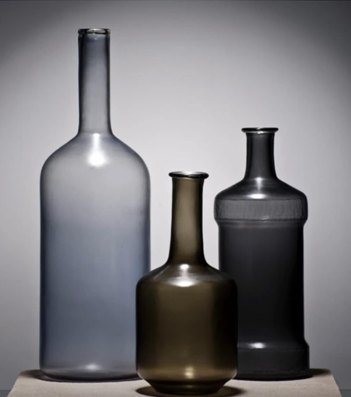 Alla Morandi, a collaboration with Venini with artist Matteo Thun, is the atemporal atmosphere of Morandi paintings in glass works. The blown glass bottles (limited edition) feature simple, smooth shapes, delicate colours, enhancing the sensorial