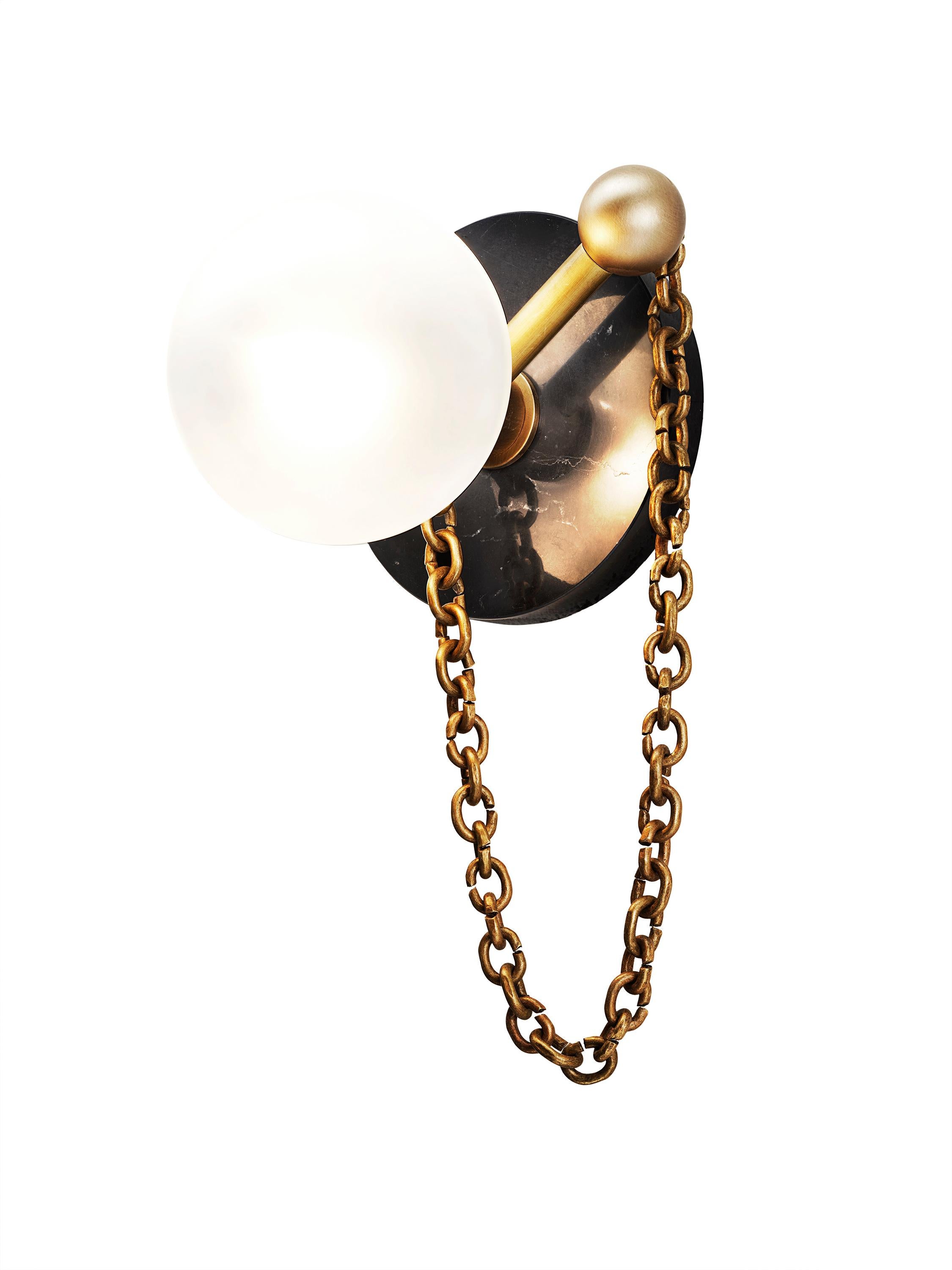 ALLA WALL SCONCE

Featuring a Marquina black marble backplate and delicate chain inspired by Christian Dior’s luxurious pearl earrings, the Alla Wall Sconce delivers a harmonious blend of simplicity and sophistication, brilliantly complementing any