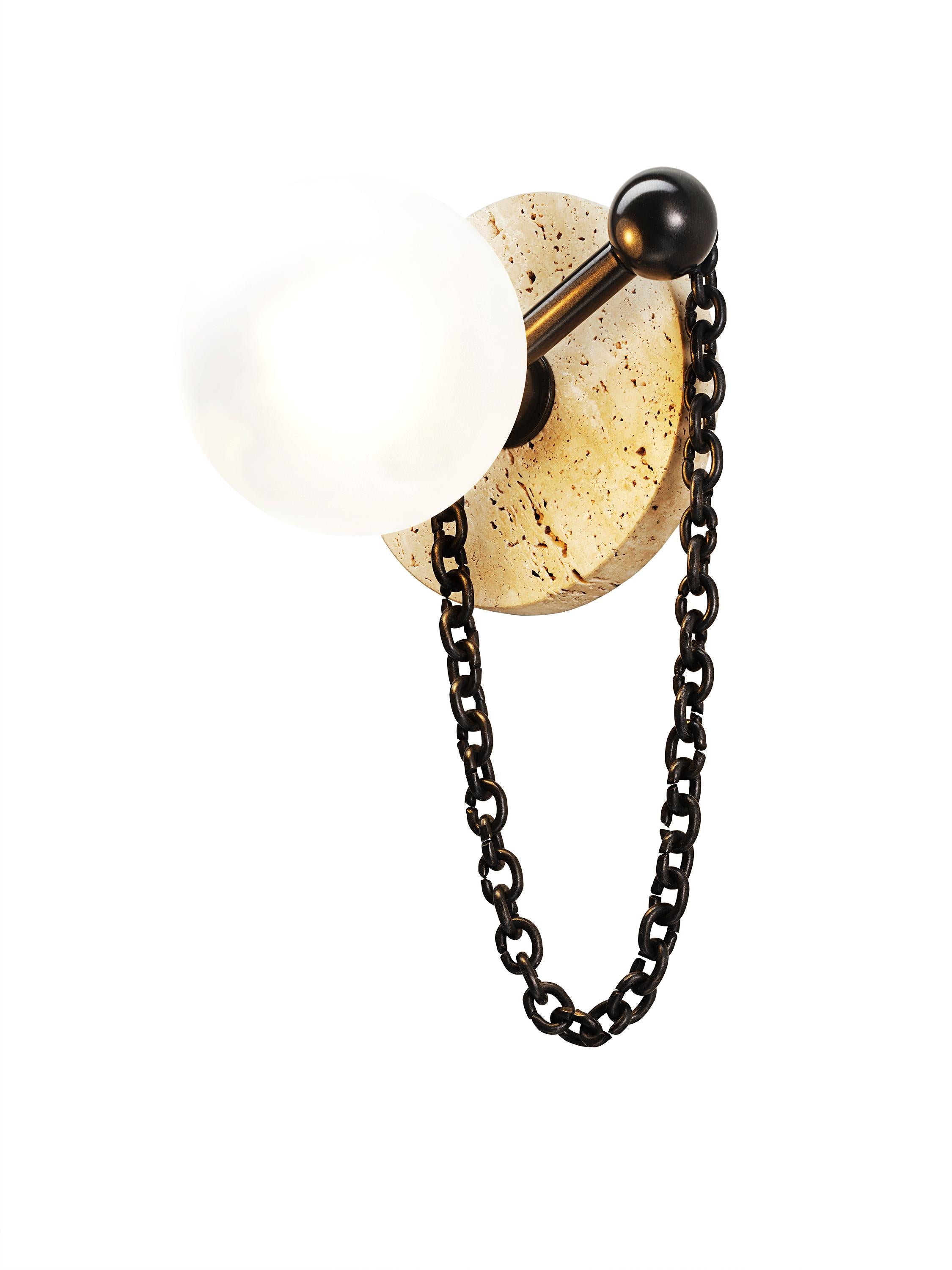 ALLA WALL SCONCE

Featuring a travertine backplate and delicate chain inspired by Christian Dior’s luxurious pearl earrings, the Alla Wall Sconce delivers a harmonious blend of simplicity and sophistication, brilliantly complementing any wall it