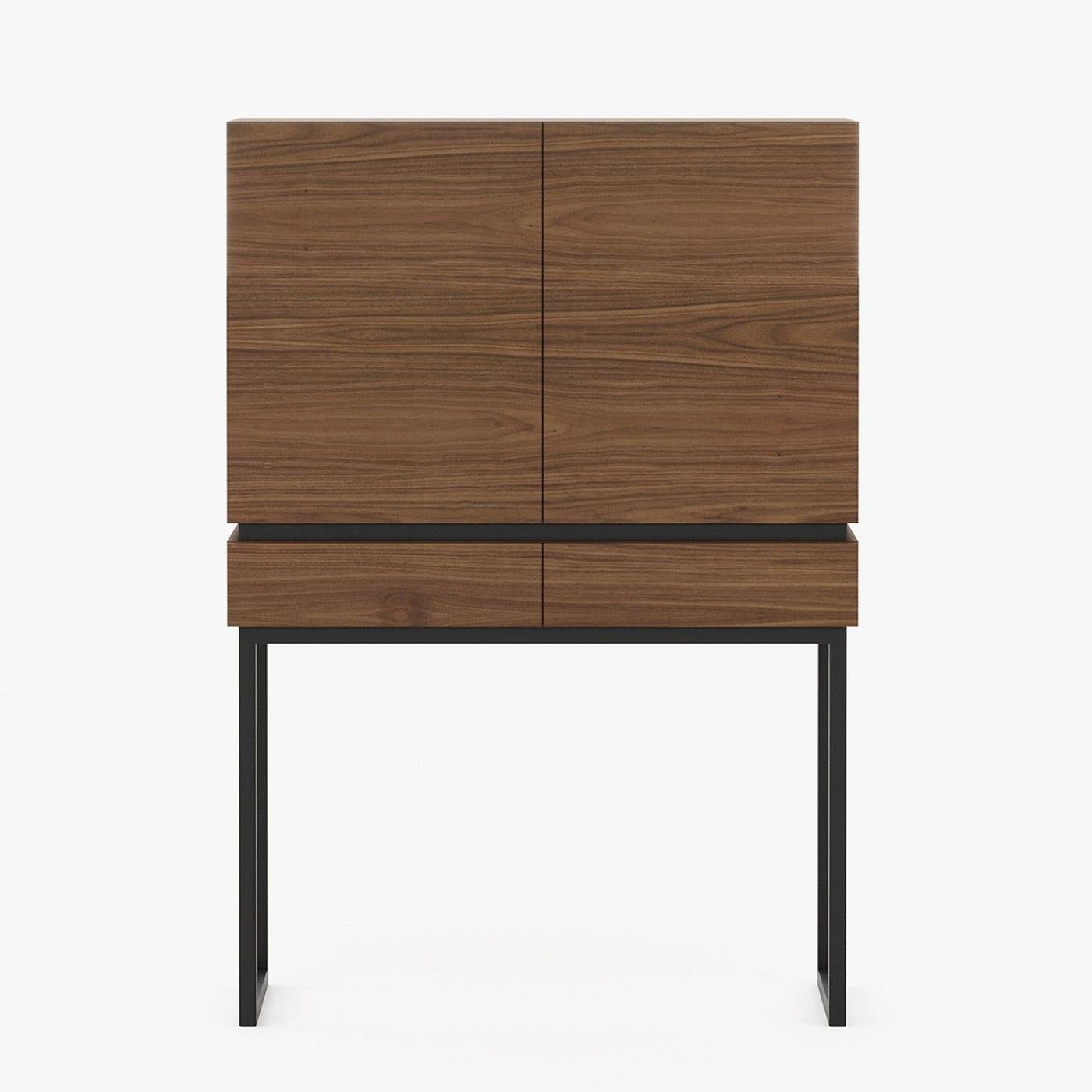 Bar cabinet Allan with wooden structure in walnut matte
veneer. Bar with 2 doors and 4 storage parts inside. Bar
with 2 drawers with easy glide system. Base structure in
polished stainless steel in black matte lacquered finish.