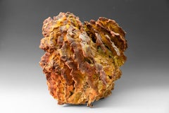 "Fire Coral", textured ceramic in golden browns, embodies essential clay