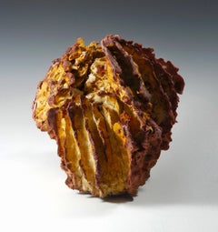 "Fire Coral", textured ceramic in golden browns, embodies essential clay