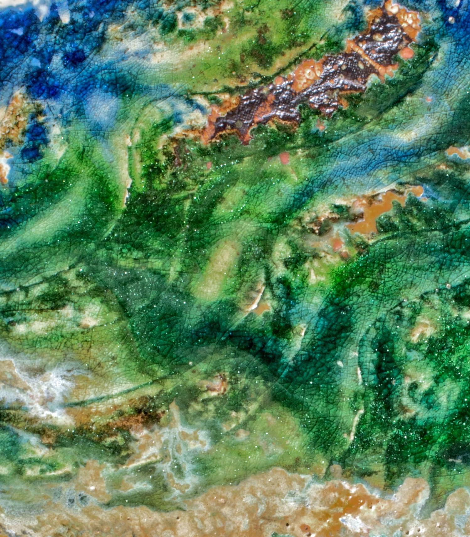 Great Lake, textured ceramic in bright blues, greens and cream, embodies the essence of clay in its organic shapes that refer directly to the earth and nature. The artist says 