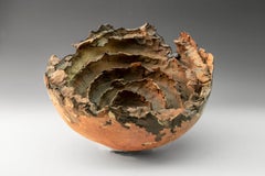 "Moon Crater", textured ceramic in golds and browns, embodies essential clay