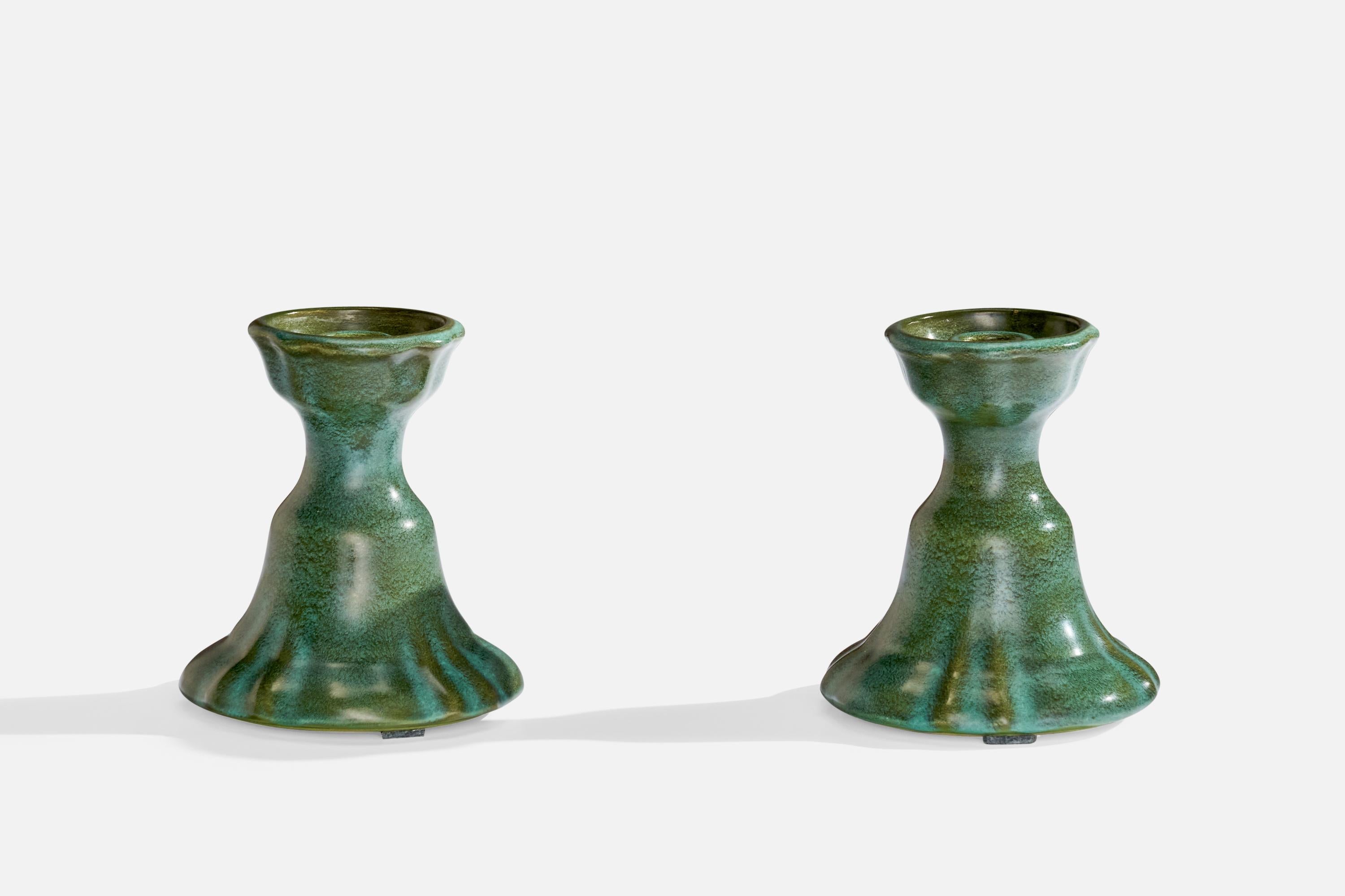 A pair of candlesticks designed designed by Allan Ebeling and produced by Bo Fajans, Sweden, c. 1920s.