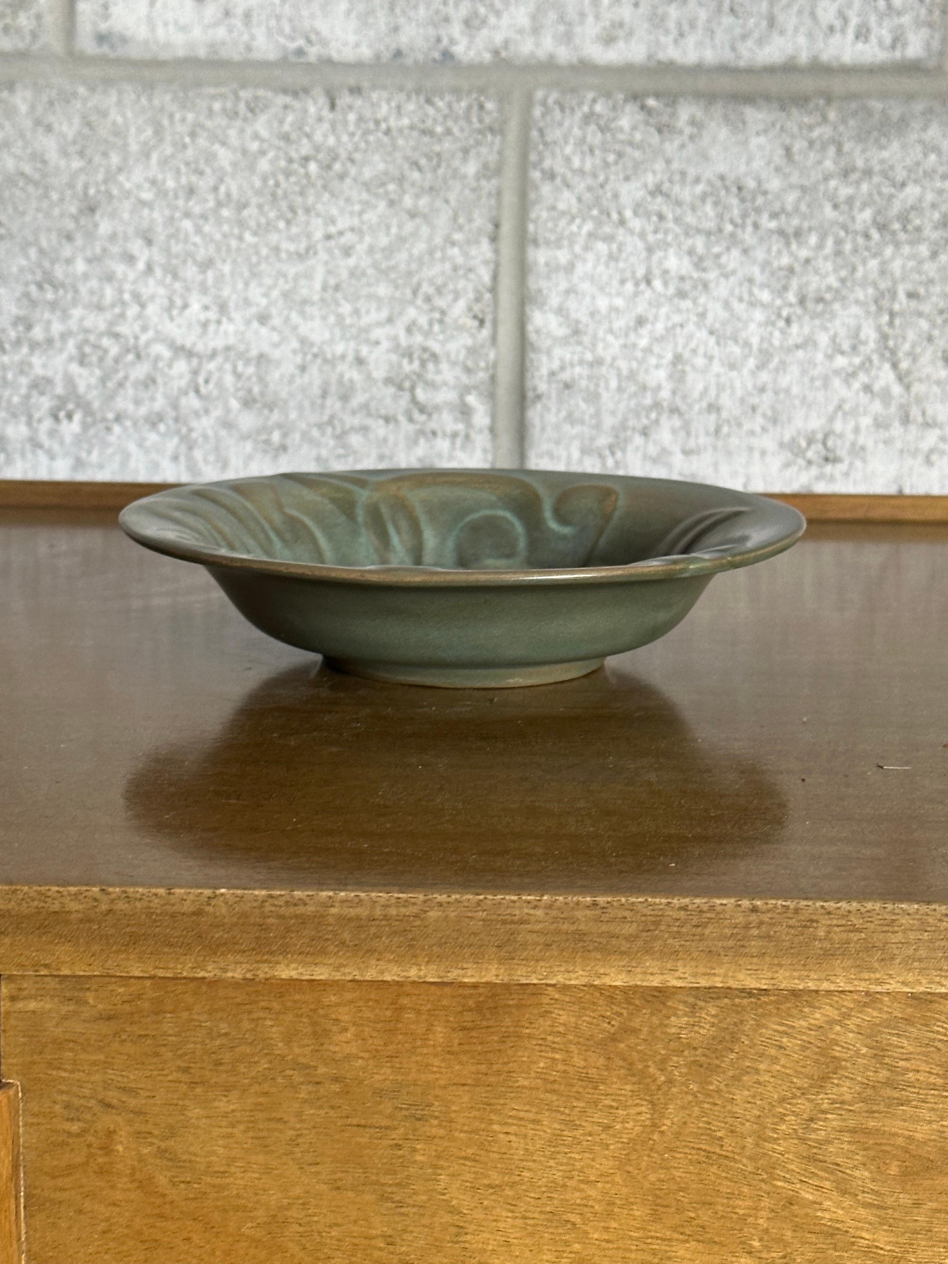 A nice well sized low bowl designed by Allan Ebeling for Bo-Fajans. Features a really interesting color which presents somewhere around teal with blue and greens in it.