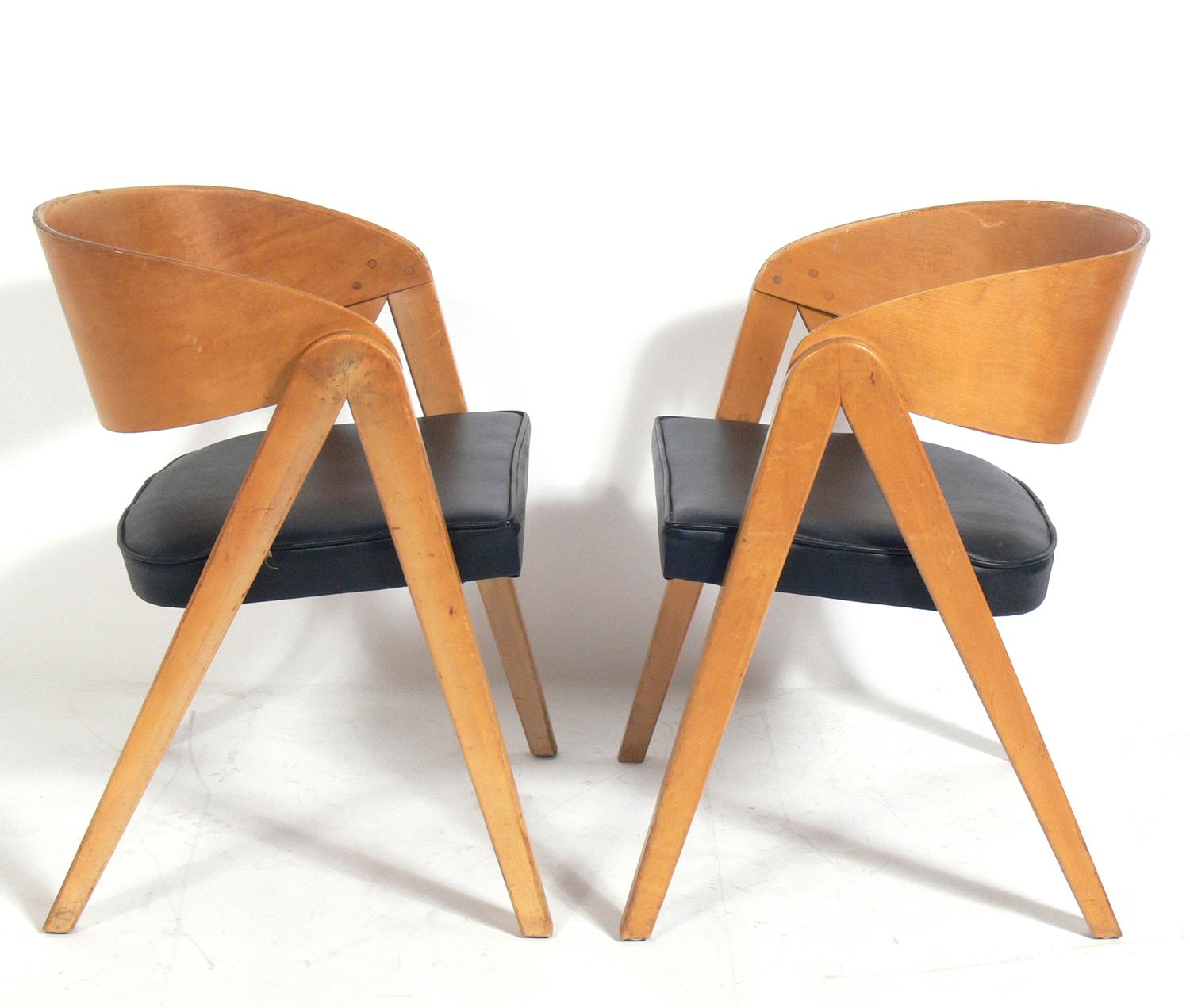 Sculptural compass form chairs, designed by Allan Gould, American, circa 1950s. They retain their original patina and wear. If you prefer, we can refinish them for an additional $450.