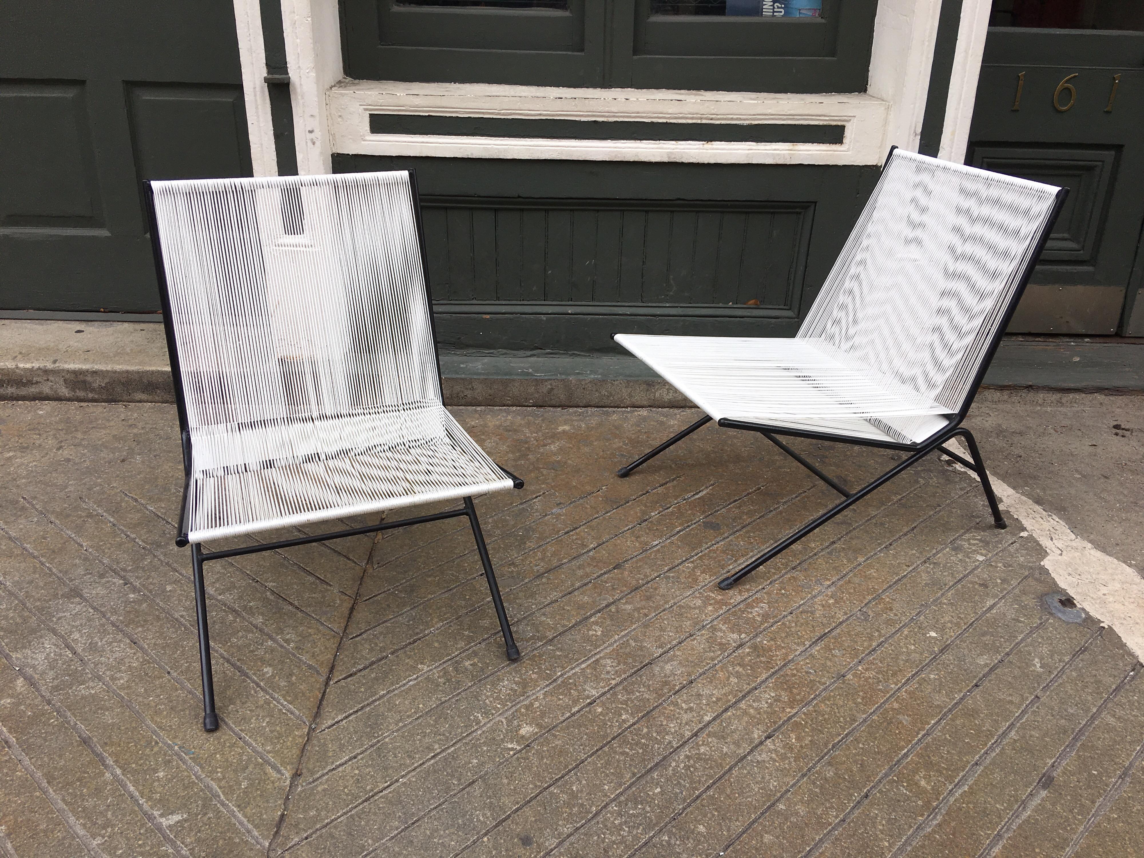 Nice pair of Allan Gould bow chairs, recently re-strung and frames repainted. Very comfortable with great lines!  Surprisingly very comfortable!  Unique Design and use of material!  Scale is perfect for smaller spaces and chairs almost disappear