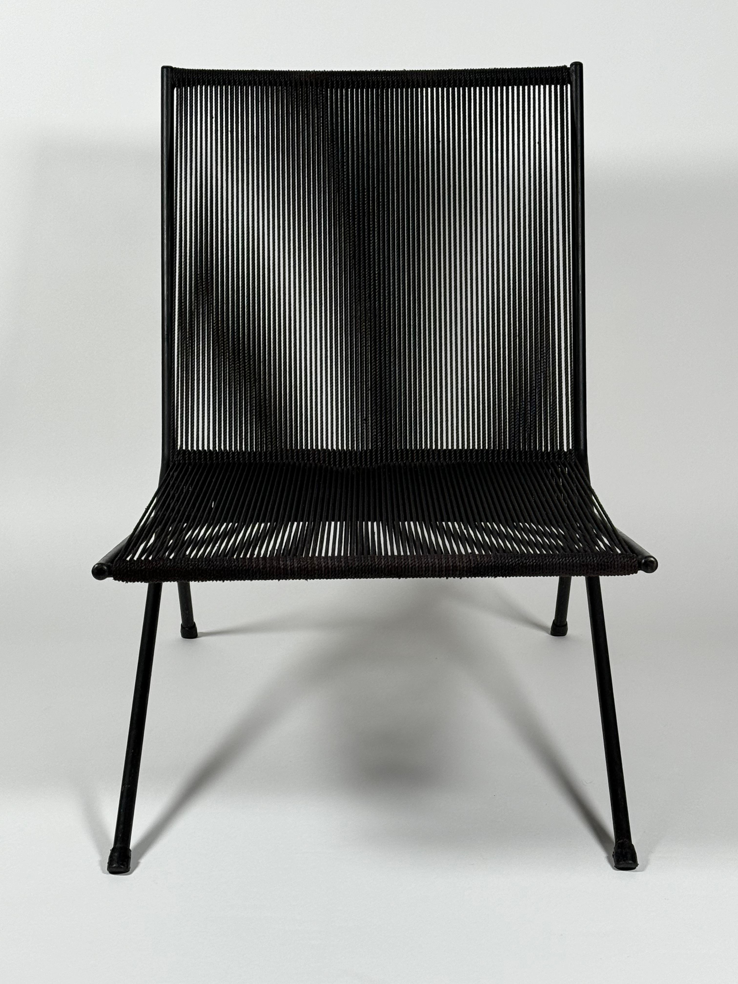 Steel and string indoor or outdoor lounge chair designed by New York designer Allan Gould circa 1950s. Constructed of black cotton cording and a black lacquered steel frame. This was his trademark design with its clean modernist lines and the optics