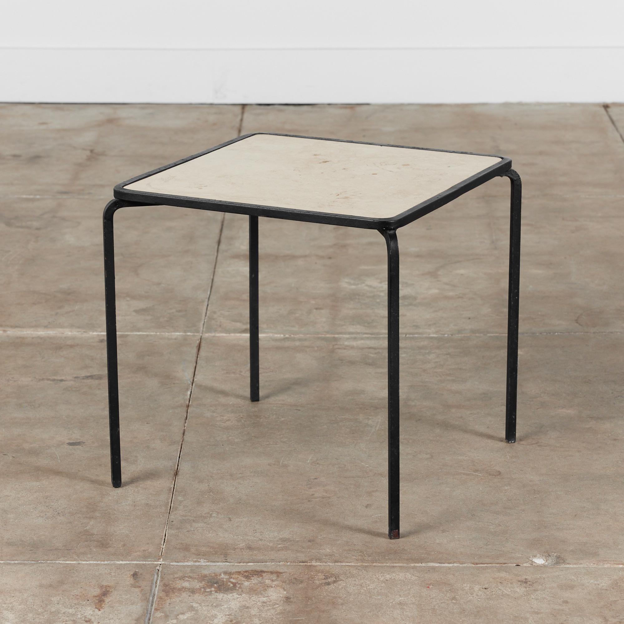 Side table by Allan Gould, for Reilly-Wolff c.1950s, USA. The table features wrought iron frame supported by slender square legs, and an inset square travertine table top.

Dimensions
17” diameter x 17
