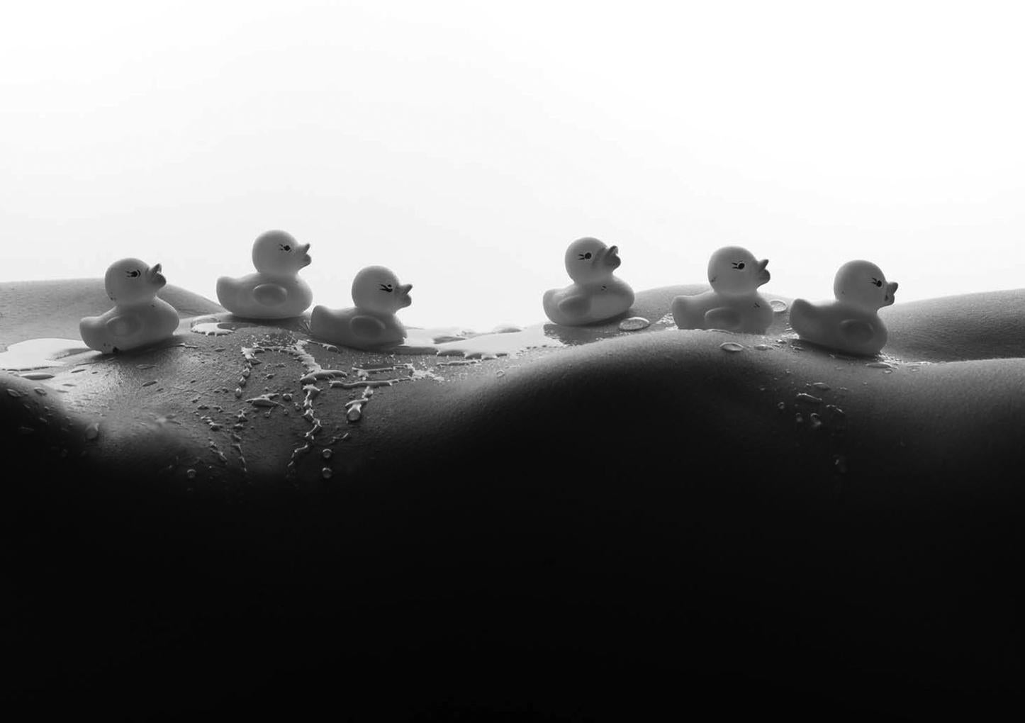 Rubber ducks - black and white photography - Photograph by Allan I. Teger