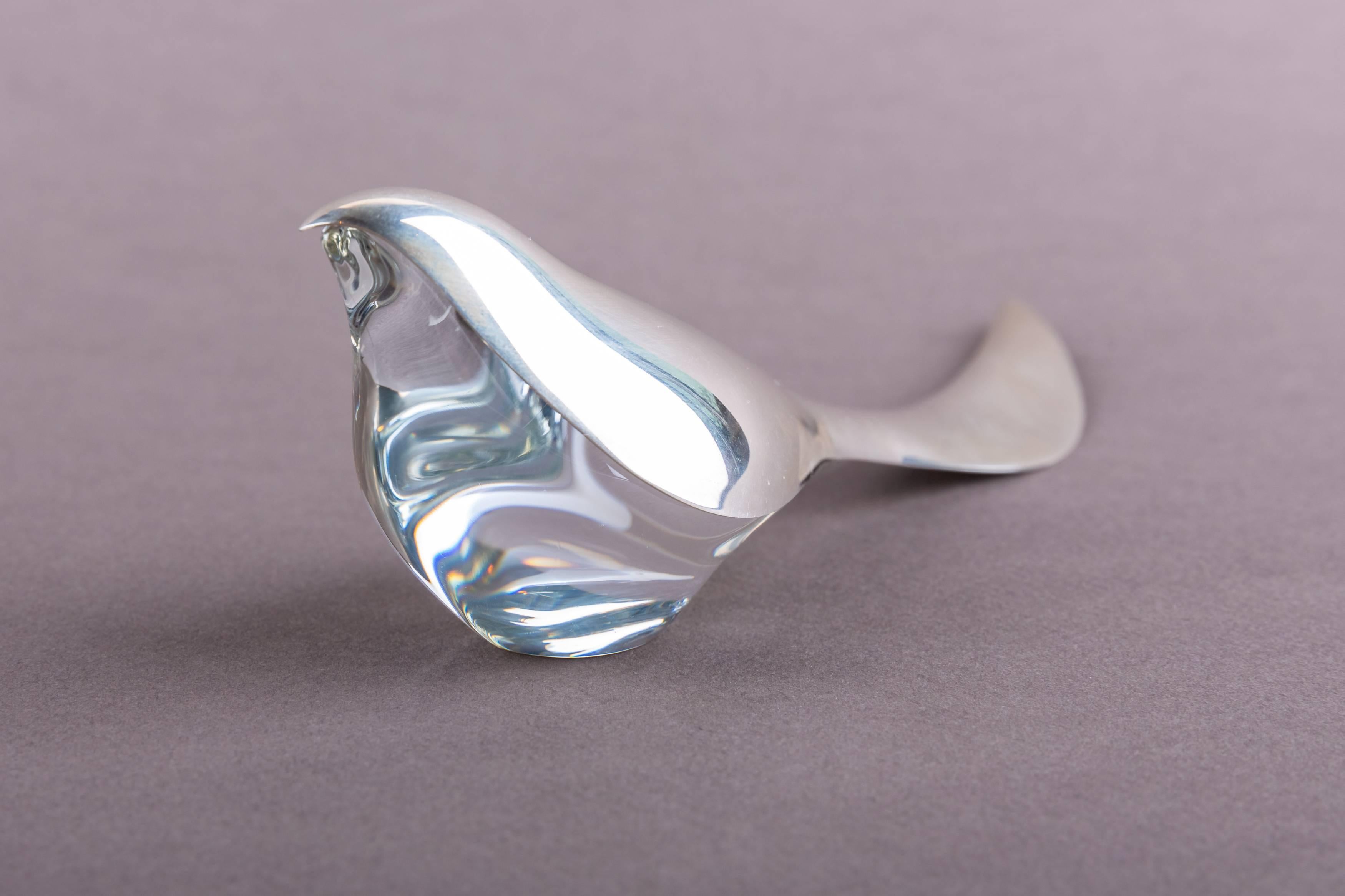A paper knife (letter opener) designed in the nineties by Allan Scharff for Georg Jensen.
The knife sits on a crystal bird.
Complete in it's original box.