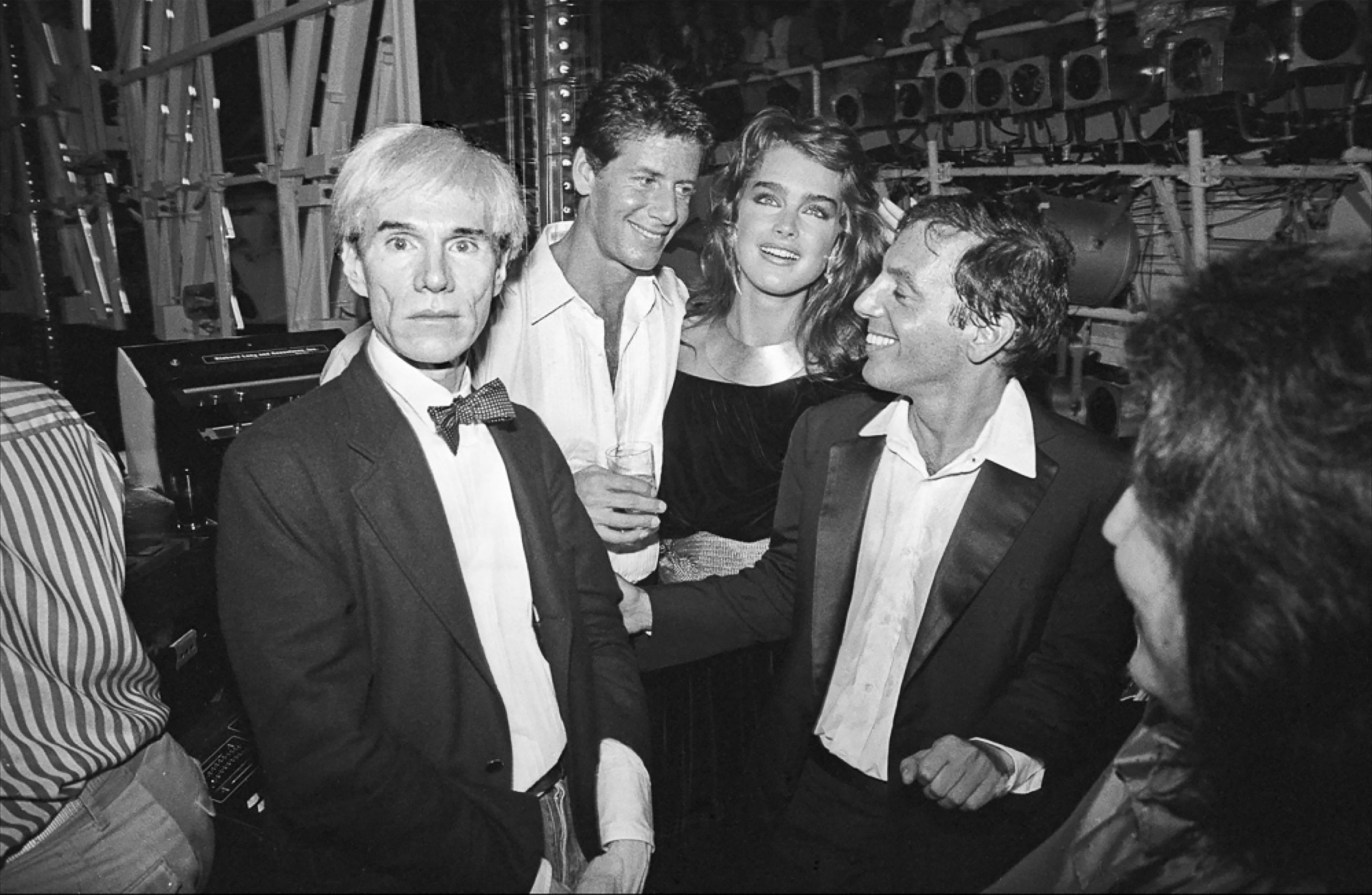 Allan Tannenbaum Black and White Photograph - Andy Warhol, Calvin Klein, Brooke Shields & Steve Rubbell At Studio 54, 1981
