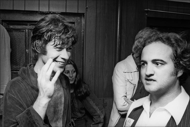 Allan Tannenbaum Black and White Photograph - John Belushi, Robbie Robertson and The Band backstage, 1976